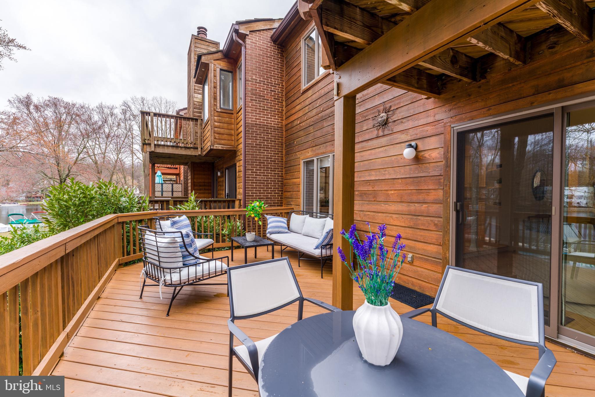 2261 Cedar Cove Court Reston, VA 20191 - Photo 35 of 102 a view of a patio with couches chairs and a potted plant