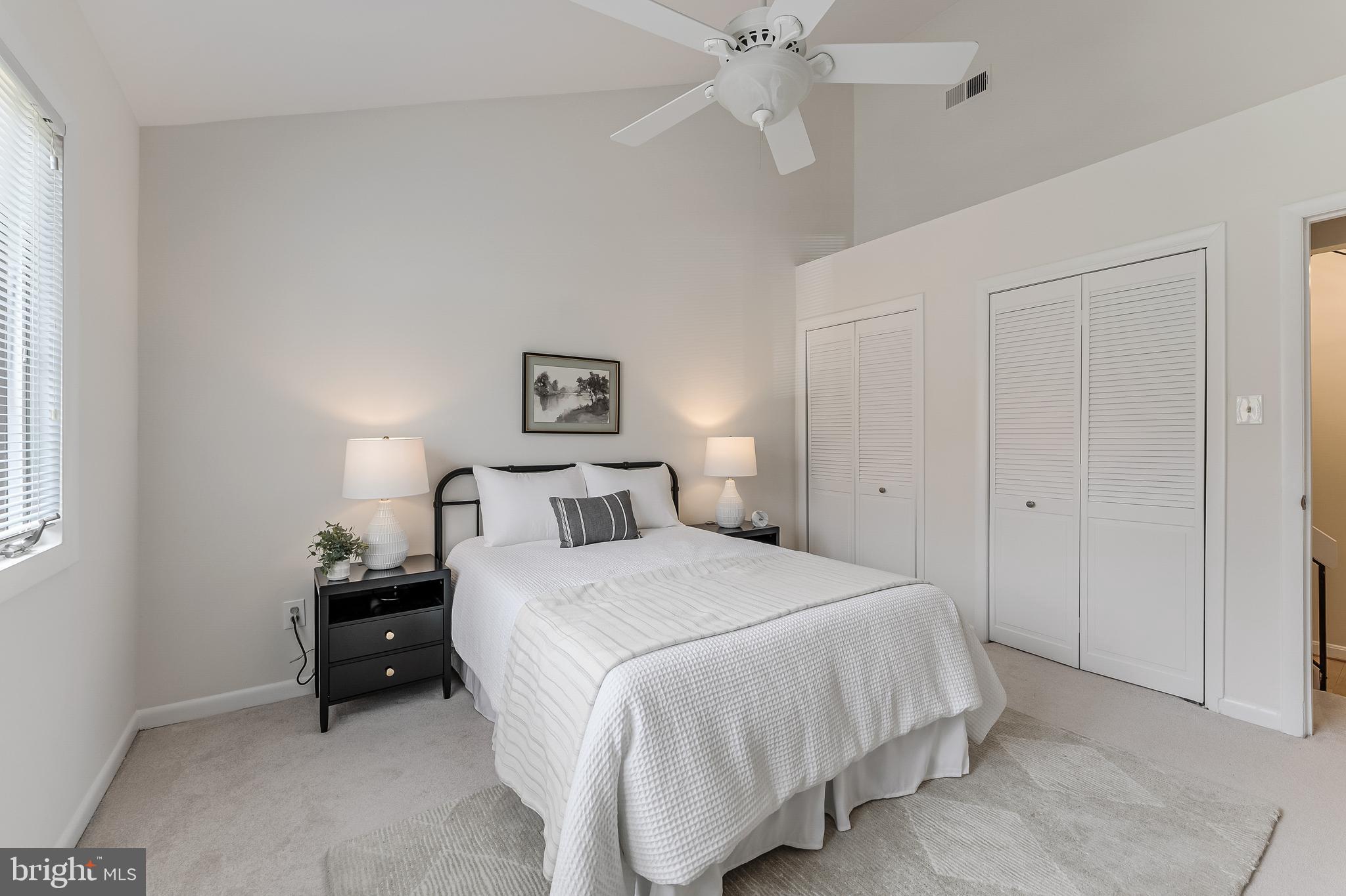2261 Cedar Cove Court Reston, VA 20191 - Photo 40 of 102 a bedroom with a bed and a chandelier