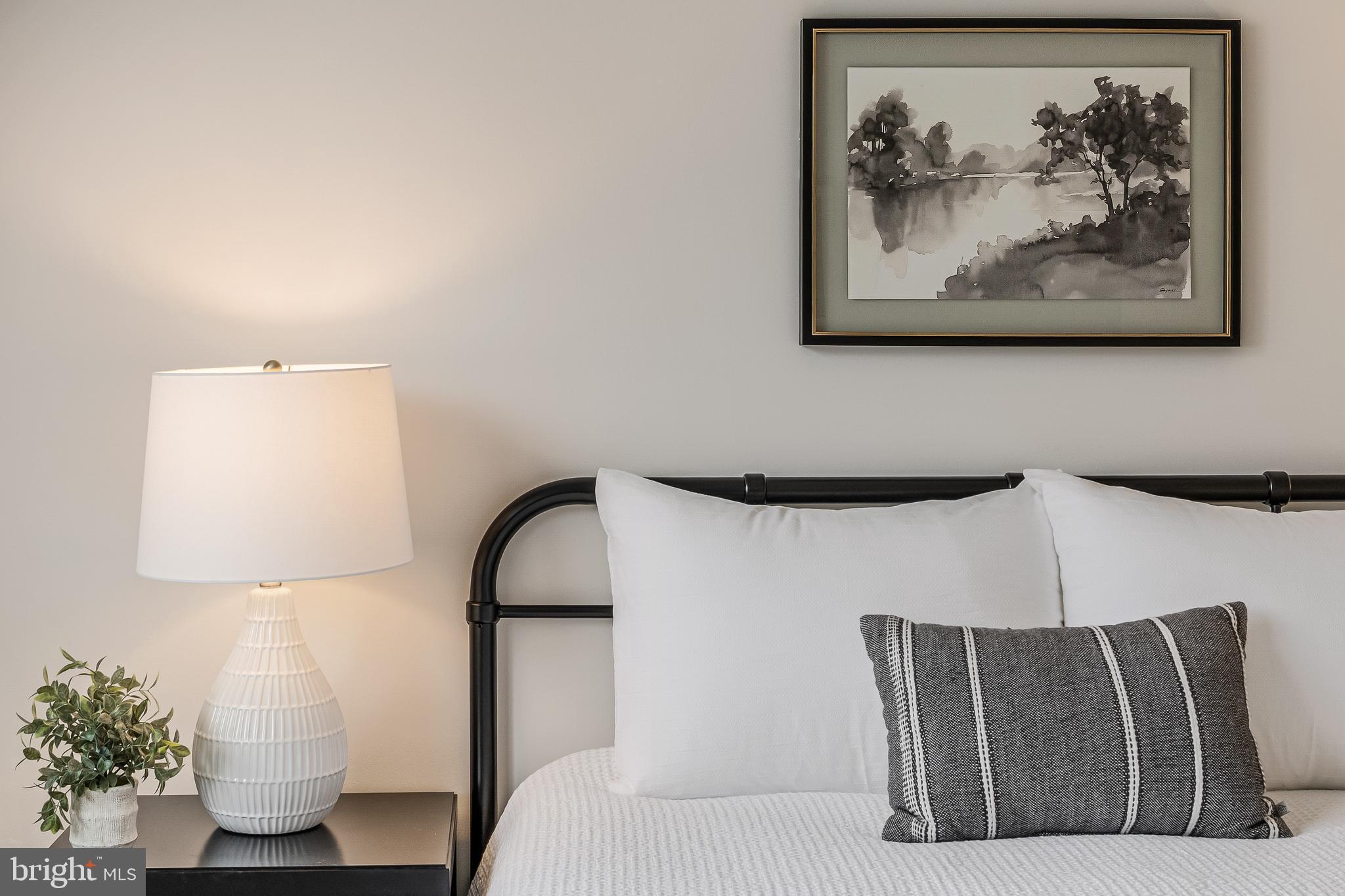 2261 Cedar Cove Court Reston, VA 20191 - Photo 42 of 102 a bedroom with a bed and a painting on the wall