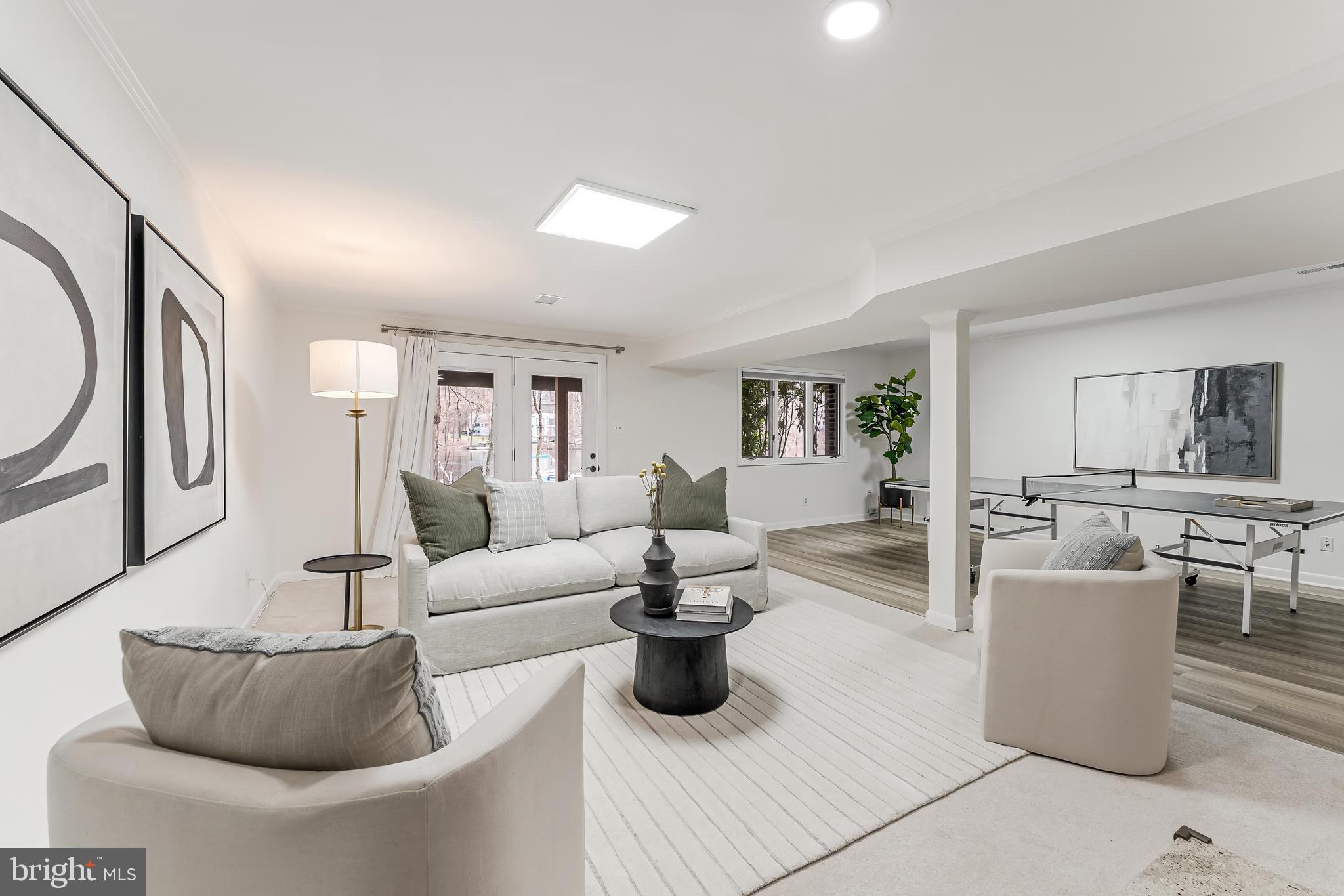 2261 Cedar Cove Court Reston, VA 20191 - Photo 60 of 102 a living room with furniture a rug and white walls