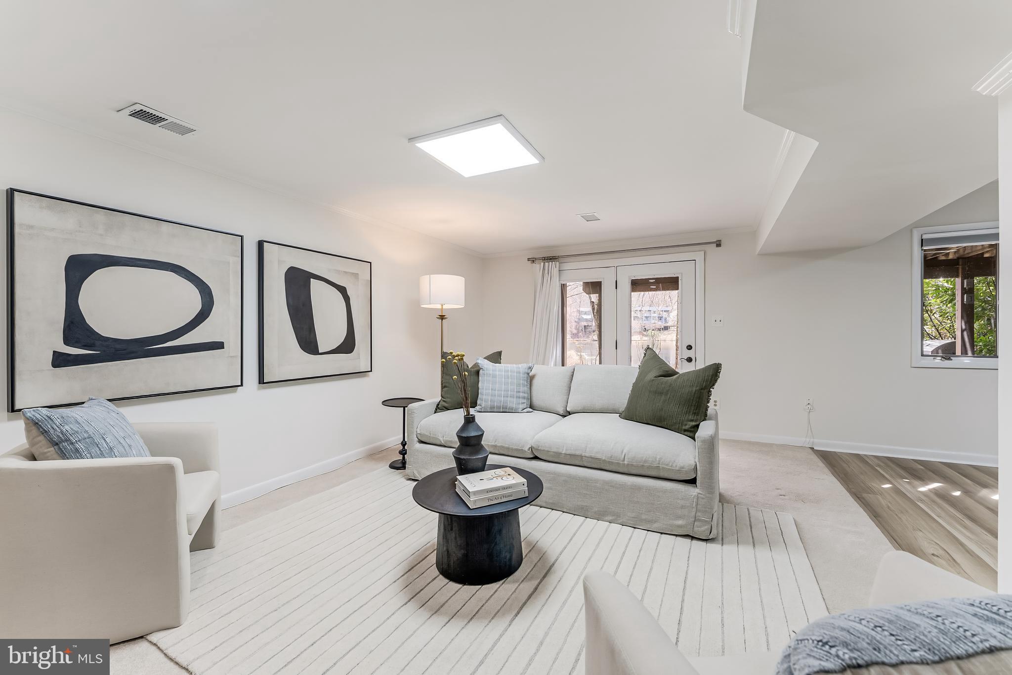 2261 Cedar Cove Court Reston, VA 20191 - Photo 61 of 102 a living room with furniture and a painting on the wall