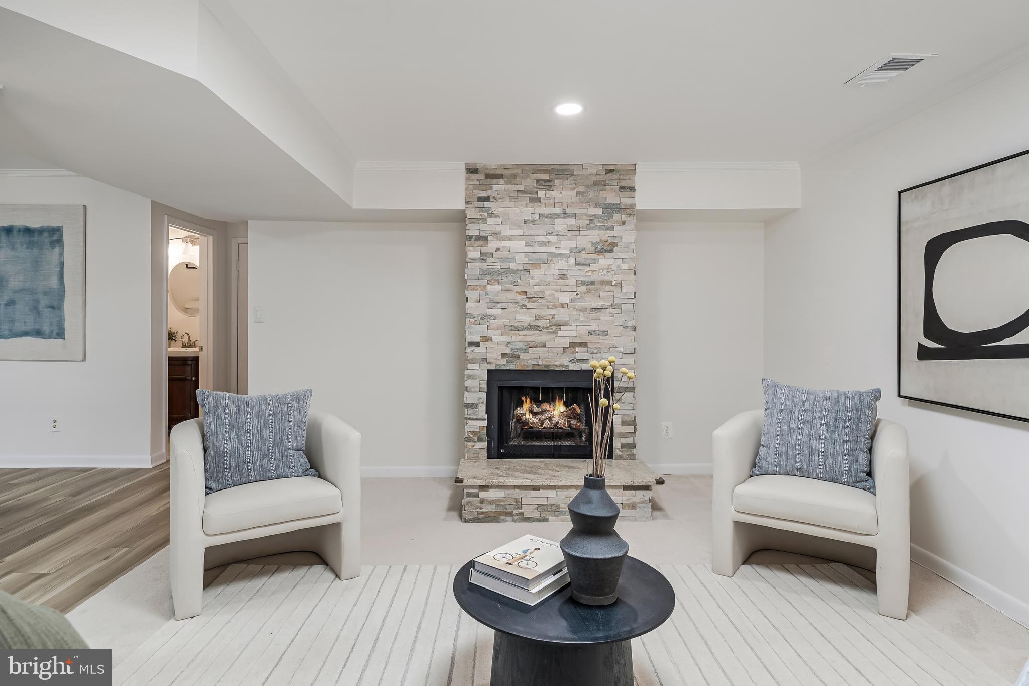 2261 Cedar Cove Court Reston, VA 20191 - Photo 63 of 102 a living room with furniture and a fireplace