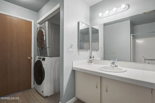 a bathroom with a double vanity sink and mirror