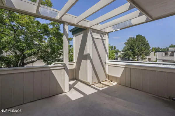 a view of outdoor with green space and wooden deck