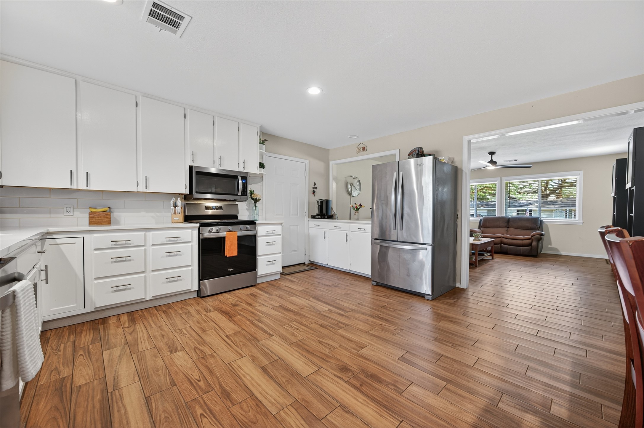204 King Drive Columbus, TX 78934 - Photo 13 of 50 a kitchen with stainless steel appliances a refrigerator sink and cabinets
