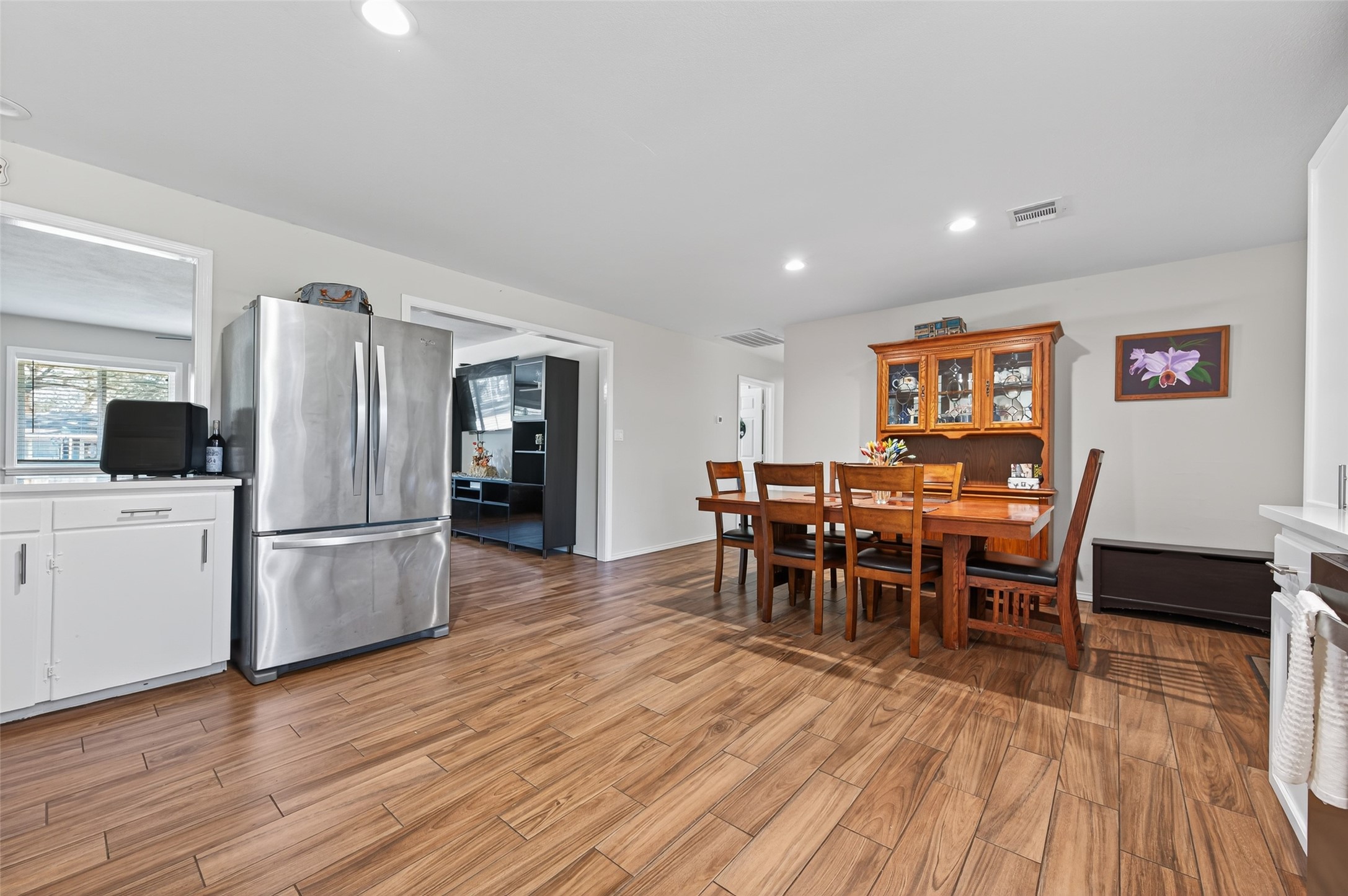 204 King Drive Columbus, TX 78934 - Photo 16 of 50 a kitchen with stainless steel appliances wooden floor and large window