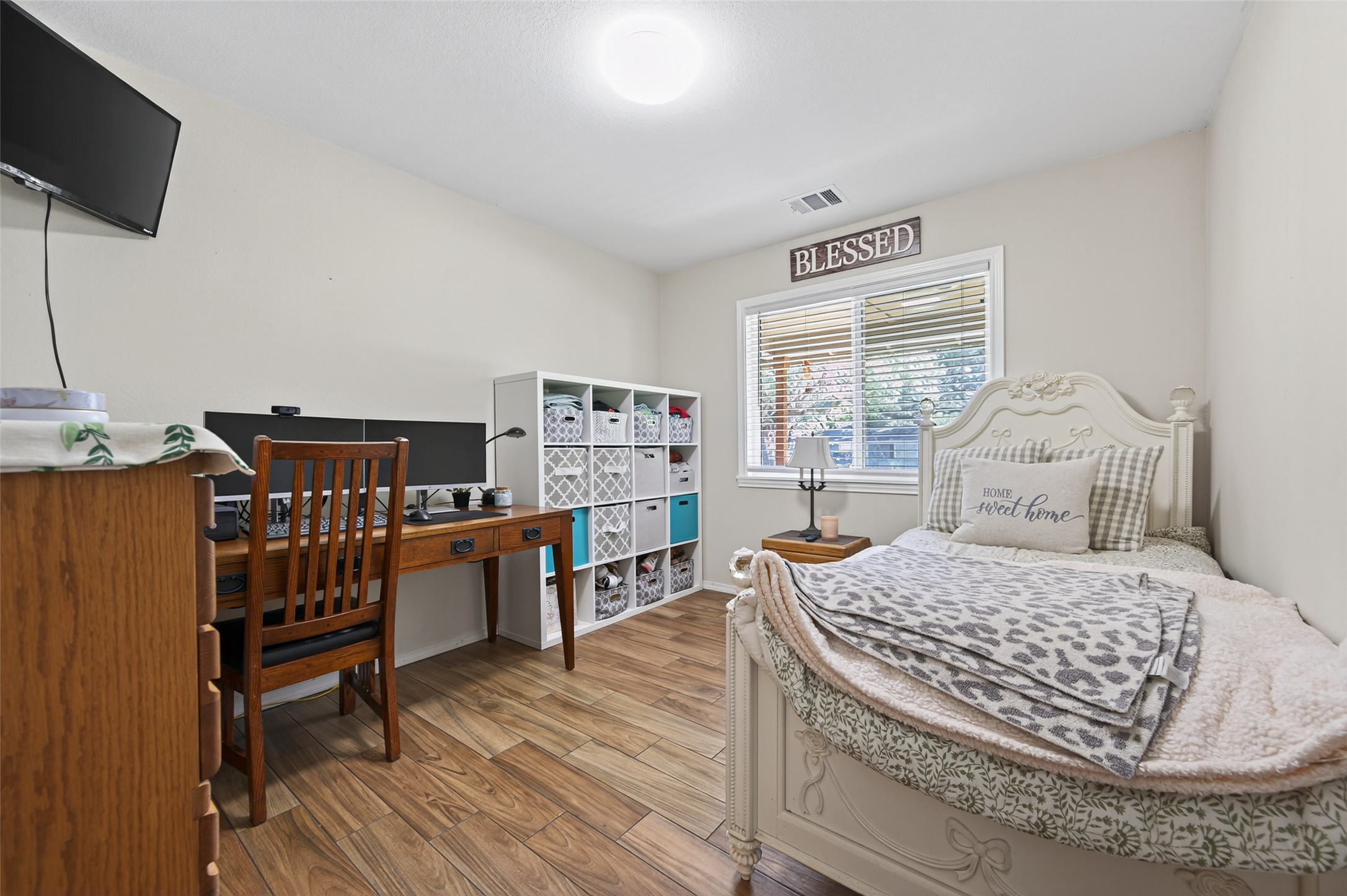 204 King Drive Columbus, TX 78934 - Photo 21 of 50 a bedroom with a bed and wooden floor