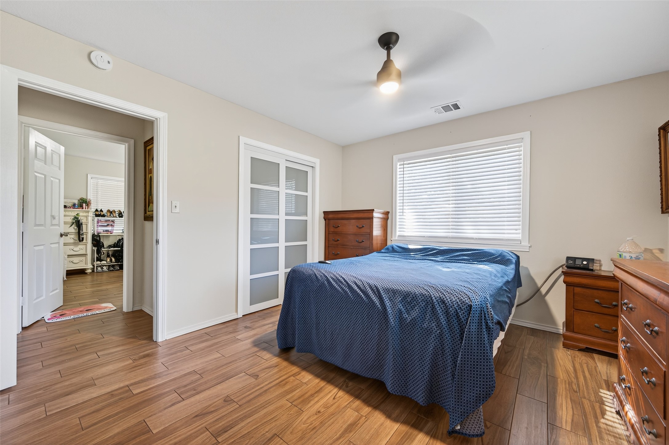 204 King Drive Columbus, TX 78934 - Photo 24 of 50 a bedroom with a bed and wooden floor