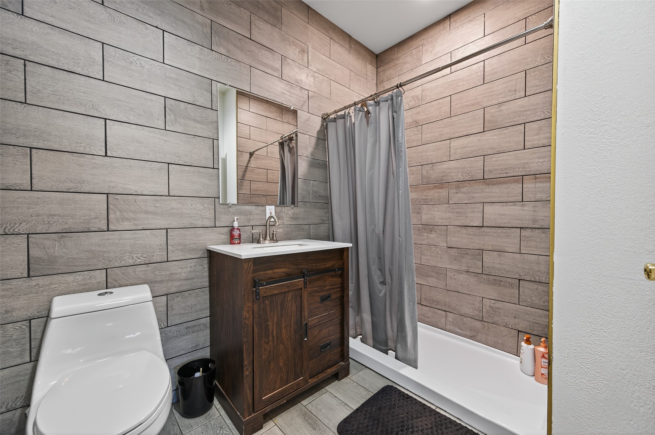 204 King Drive Columbus, TX 78934 - Photo 34 of 50 a bathroom with a sink a toilet and shower