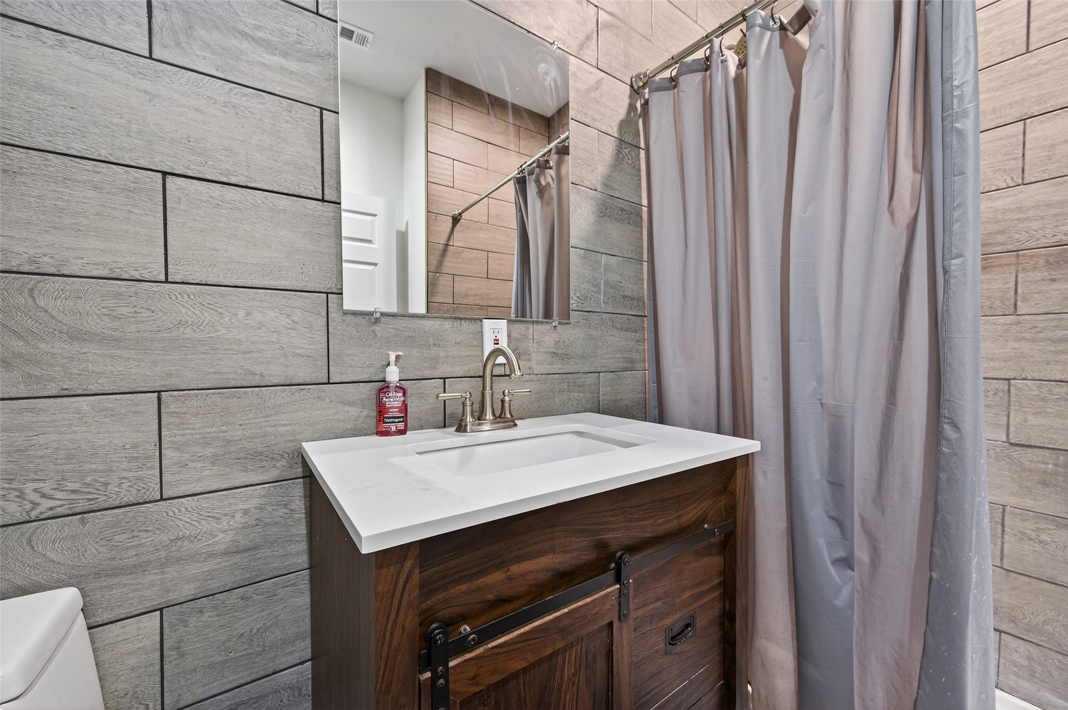 204 King Drive Columbus, TX 78934 - Photo 35 of 50 a bathroom with a sink vanity and a mirror