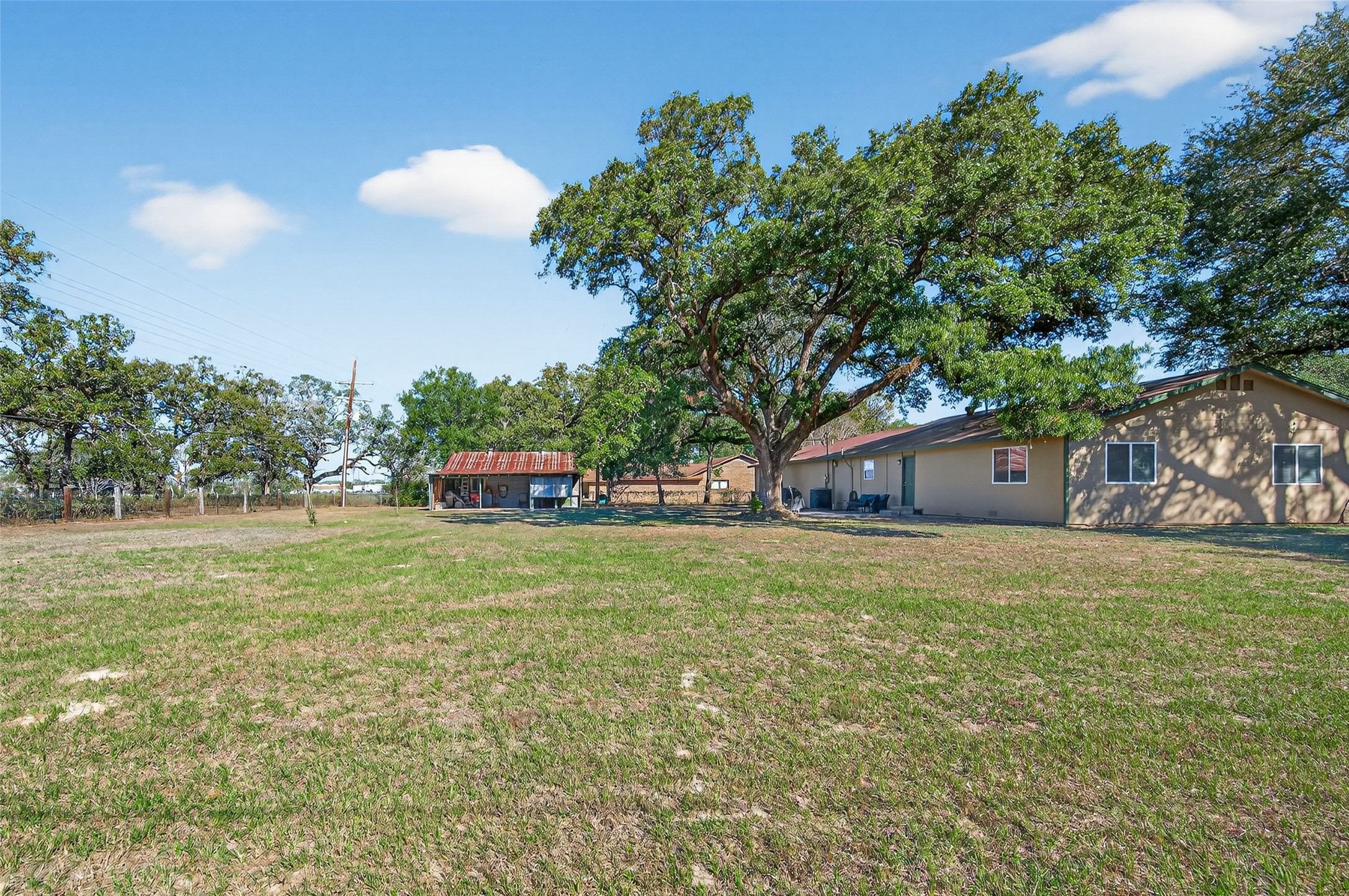 204 King Drive Columbus, TX 78934 - Photo 41 of 50 a front view of a house with a garden and trees