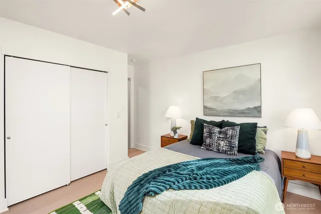 a bathroom with a toilet a sink and a mirror