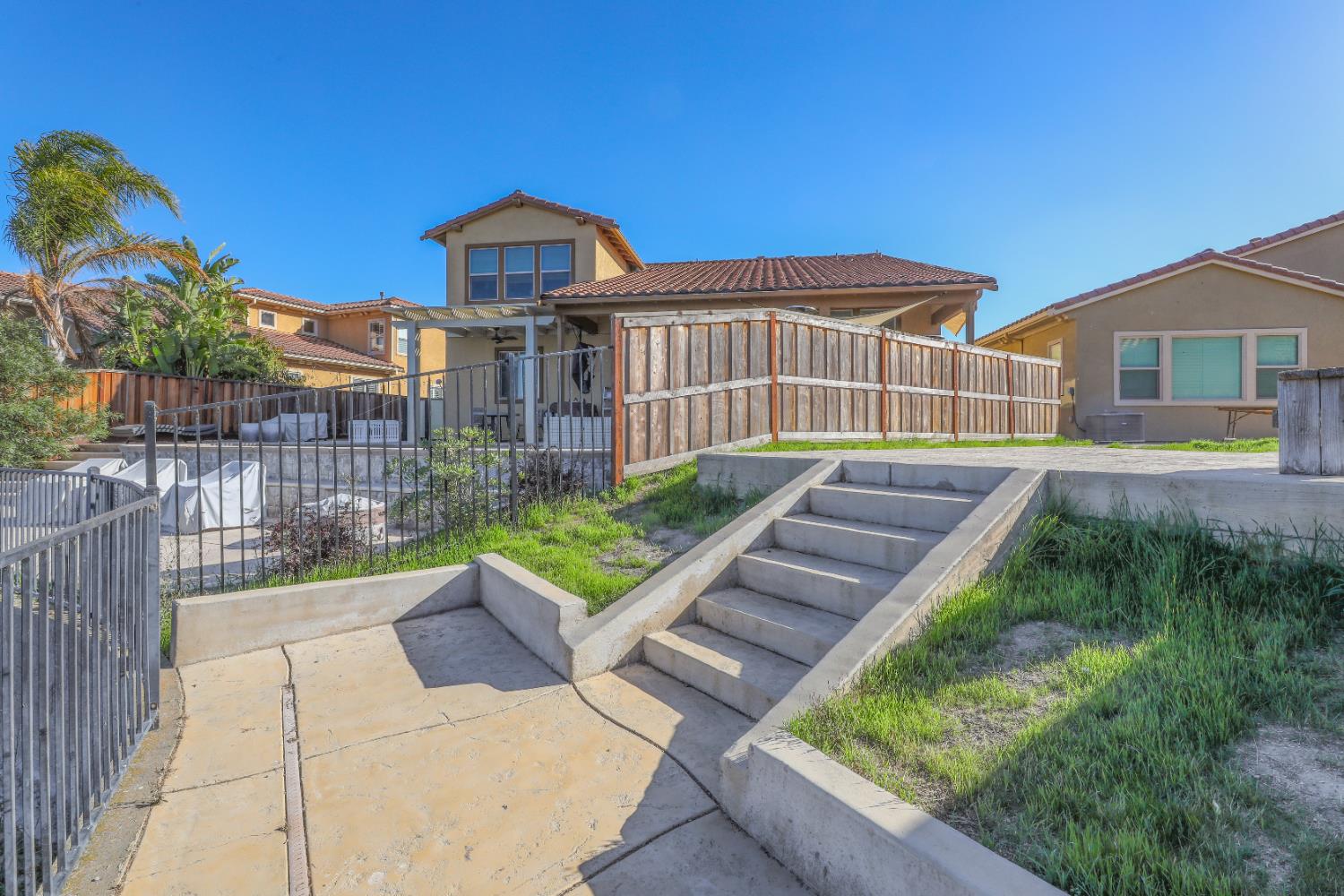 4129 Castellina Way Manteca, CA 95337 - Photo 16 of 58 a view of a chair and table in the backyard