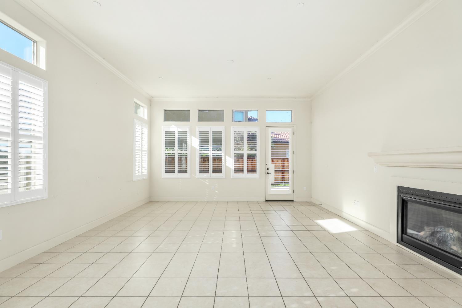 4129 Castellina Way Manteca, CA 95337 - Photo 17 of 58 a view of an empty room with a fireplace