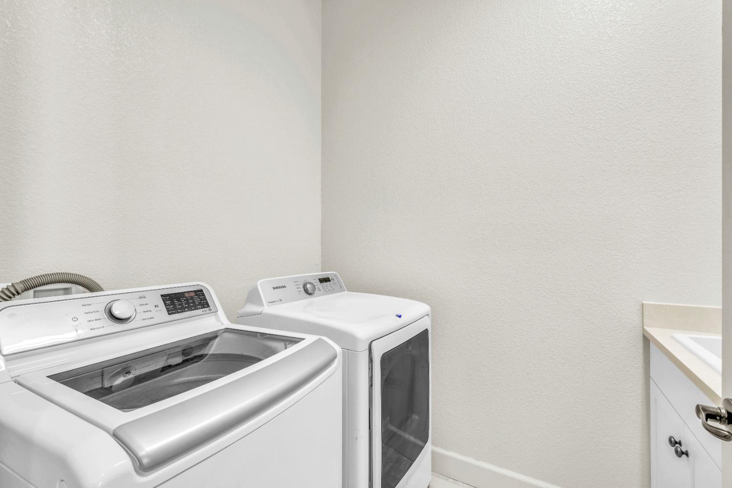 4129 Castellina Way Manteca, CA 95337 - Photo 32 of 58 a utility room with dryer and washer