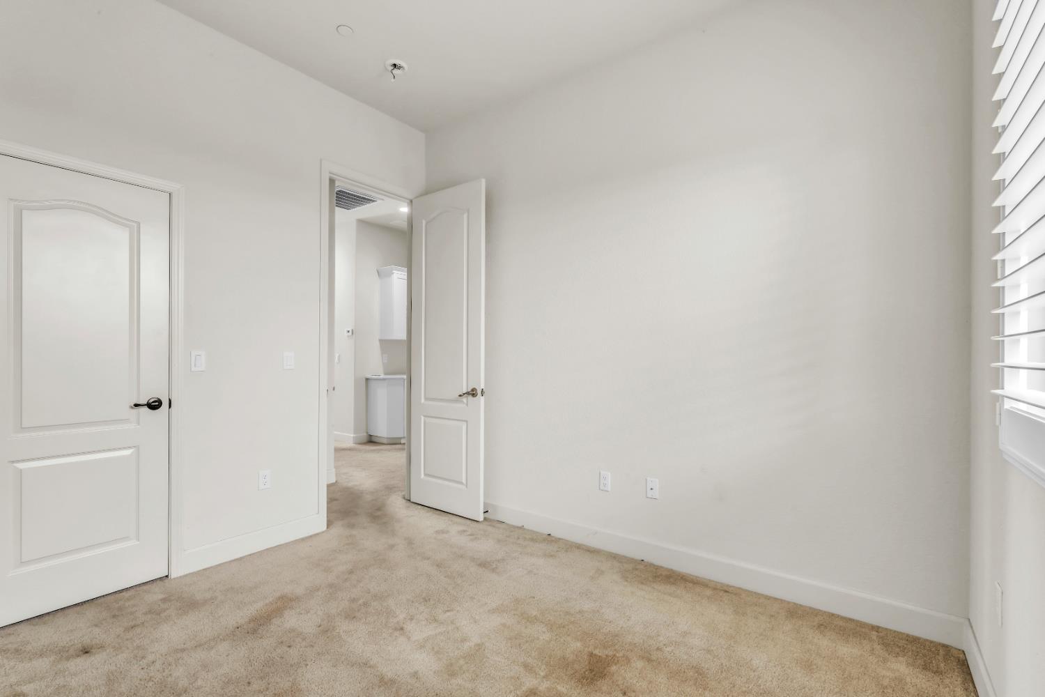 4129 Castellina Way Manteca, CA 95337 - Photo 42 of 58 an empty room with windows and closet