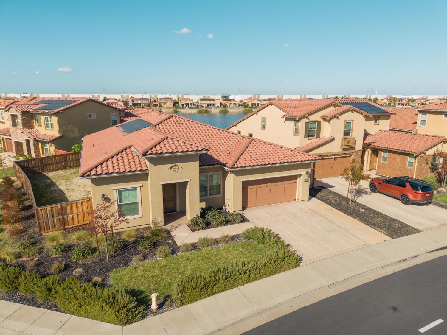 4129 Castellina Way Manteca, CA 95337 - Photo 43 of 58 front view of a house with a yard