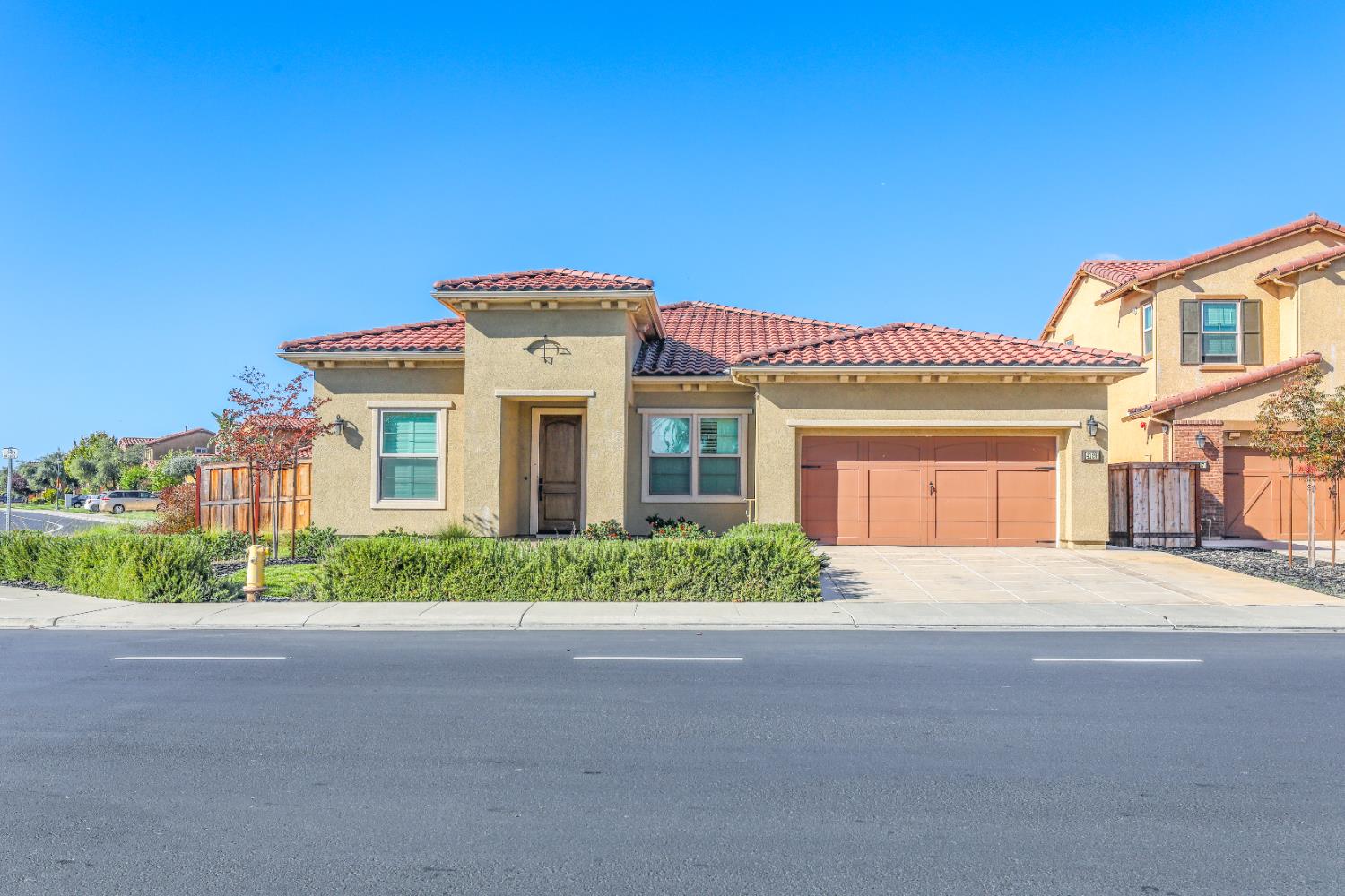 4129 Castellina Way Manteca, CA 95337 - Photo 5 of 58 a front view of a house with a garden
