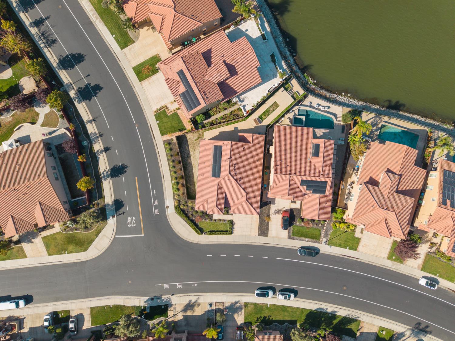 4129 Castellina Way Manteca, CA 95337 - Photo 52 of 58 an aerial view of residential houses with outdoor space and parking