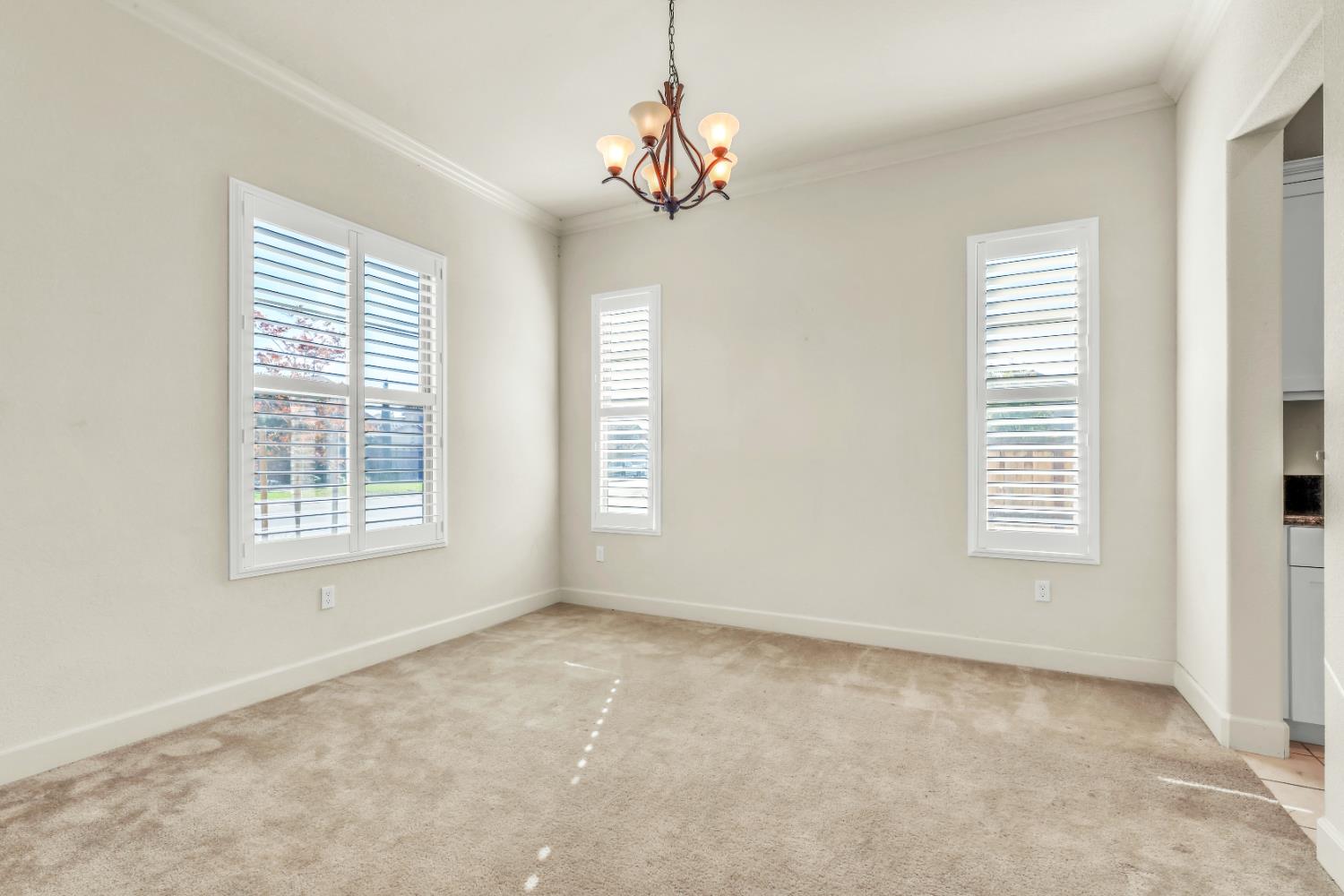 4129 Castellina Way Manteca, CA 95337 - Photo 8 of 58 a view of an empty room with a window
