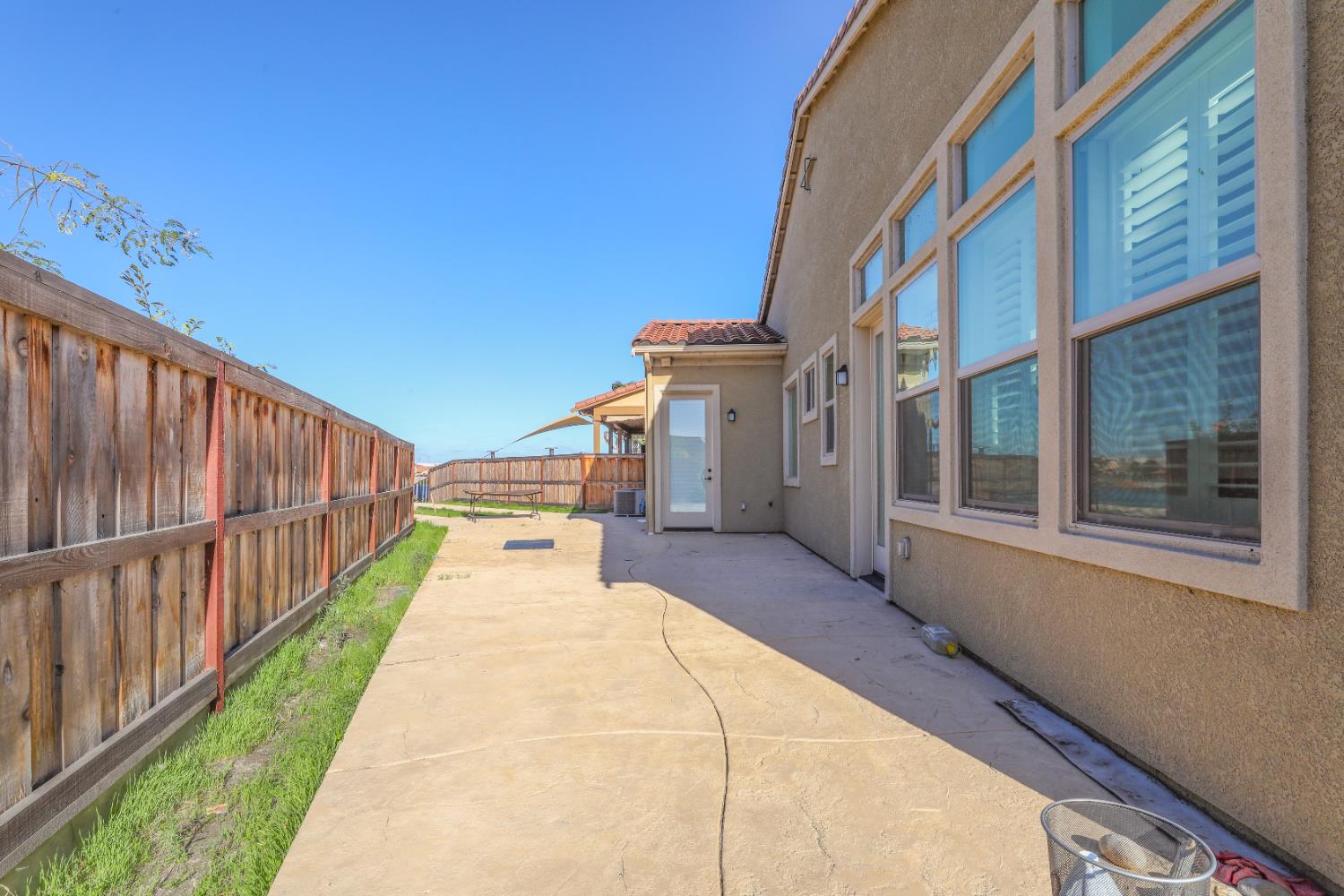 4129 Castellina Way Manteca, CA 95337 - Photo 10 of 58 a view of a building with wooden floor and fence