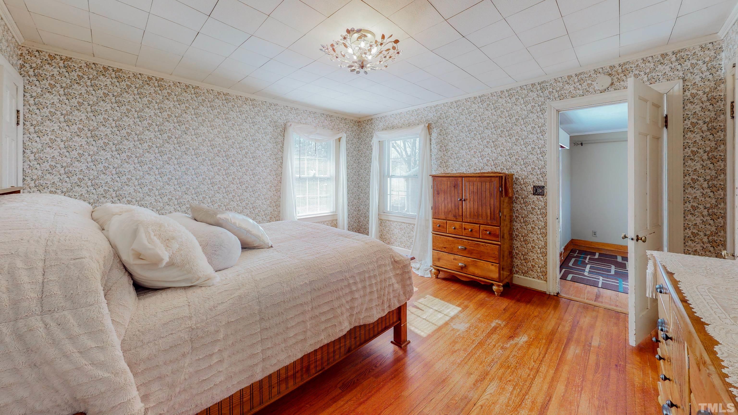 155 Hesters Store Road Roxboro, NC 27574 - Photo 12 of 77 a bedroom with a bed and wooden floor