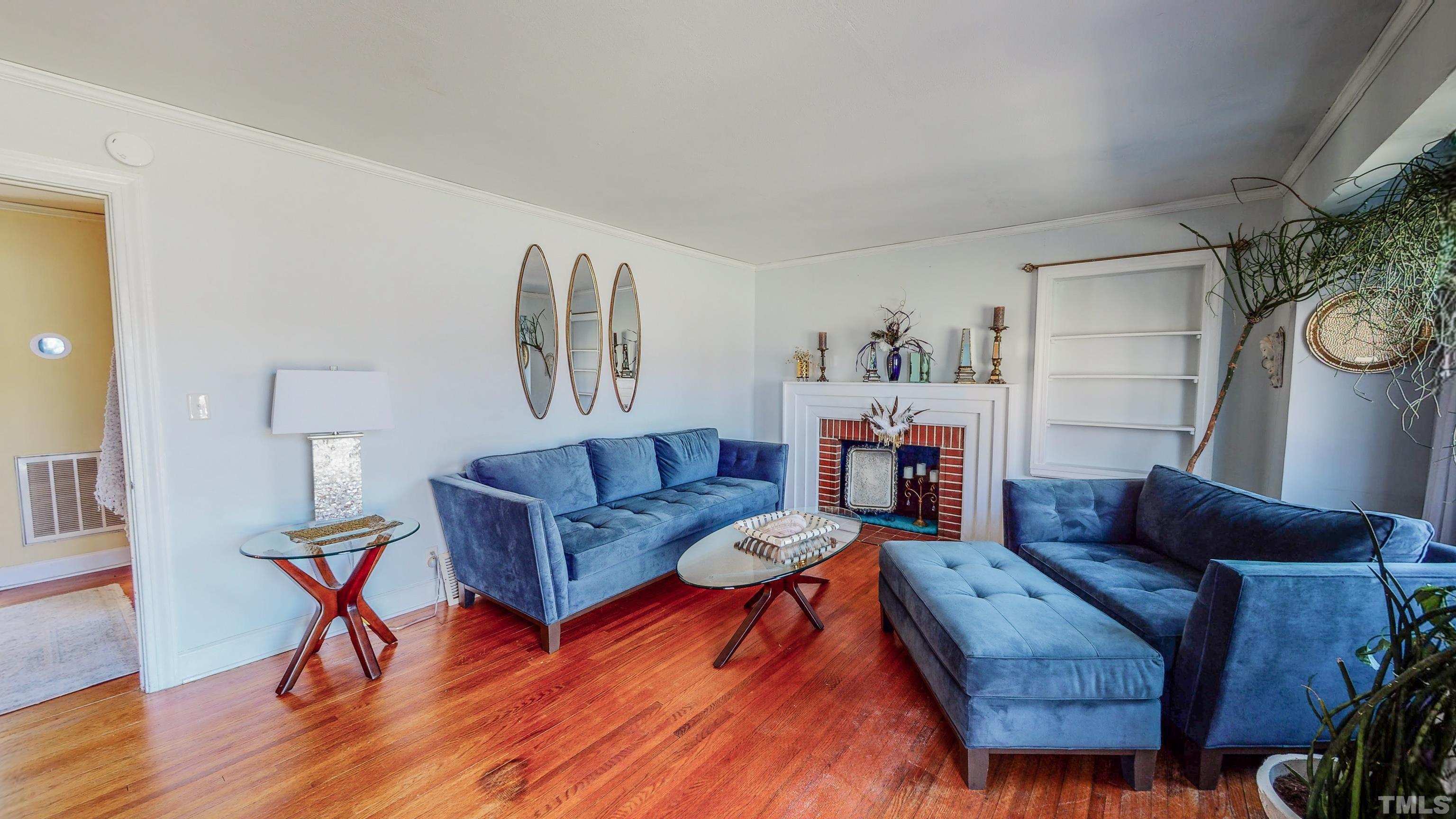 155 Hesters Store Road Roxboro, NC 27574 - Photo 2 of 77 a living room with furniture and wooden floor