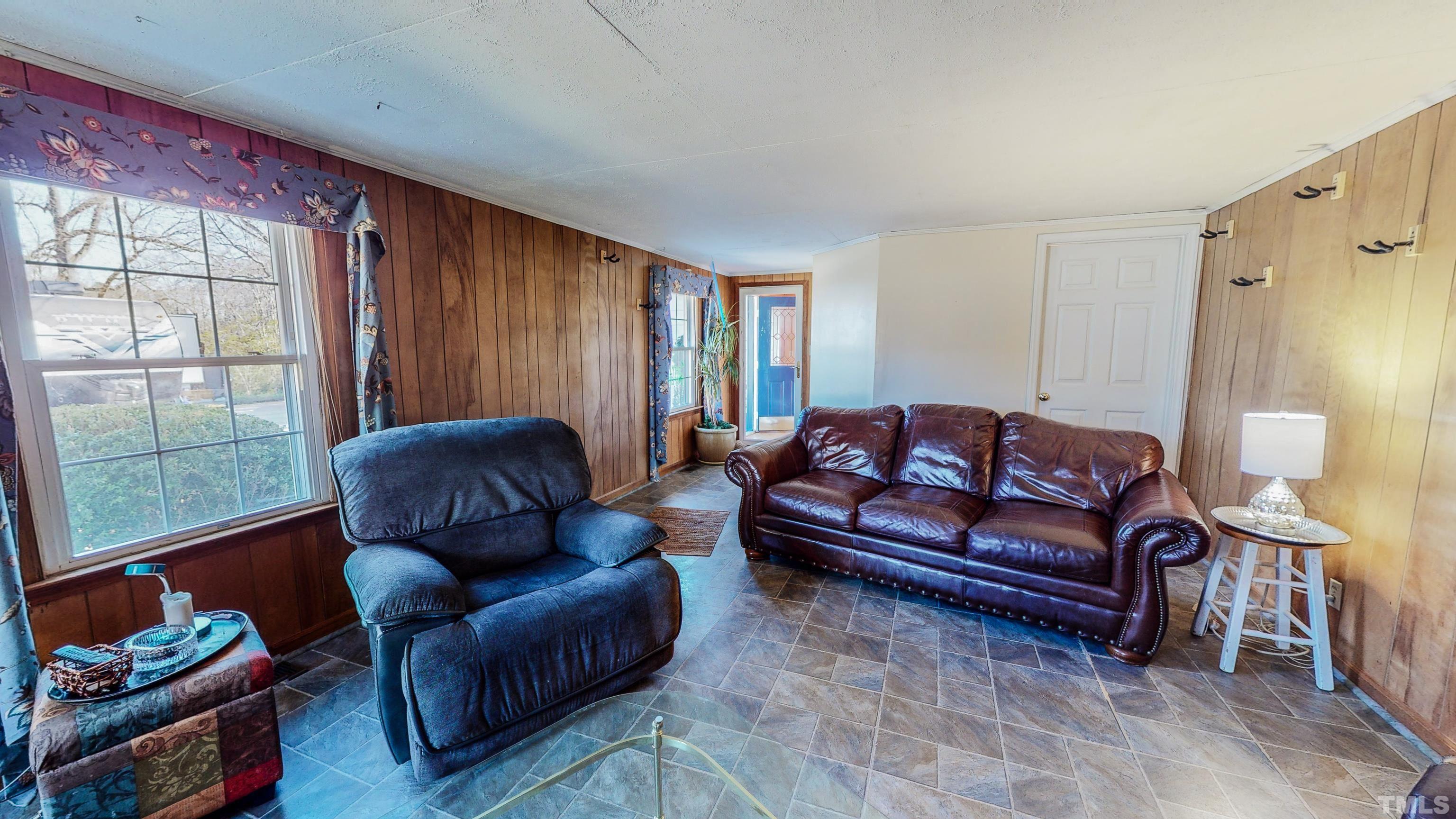 155 Hesters Store Road Roxboro, NC 27574 - Photo 28 of 77 a living room with furniture and a window