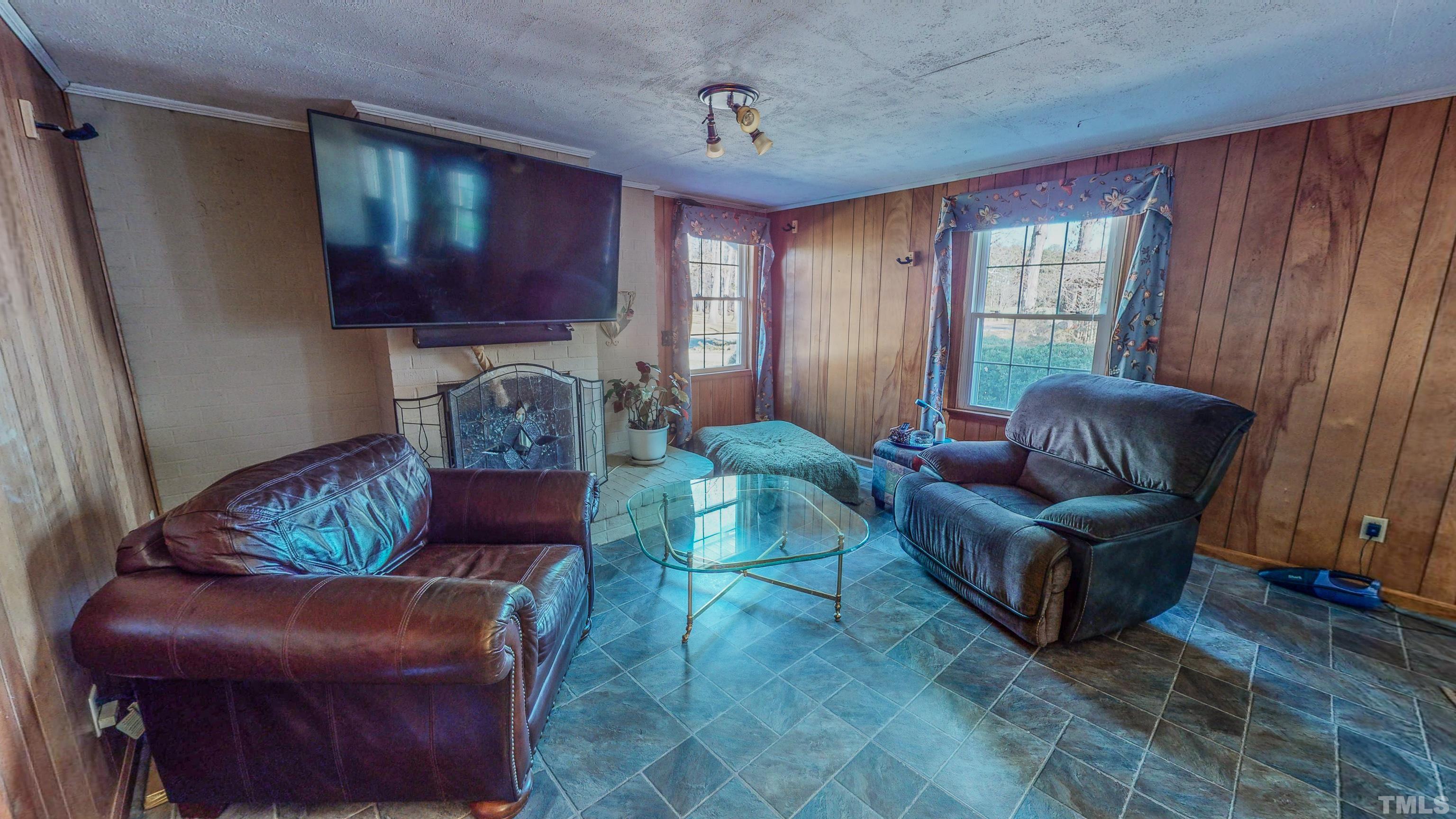 155 Hesters Store Road Roxboro, NC 27574 - Photo 29 of 77 a living room with furniture and a window