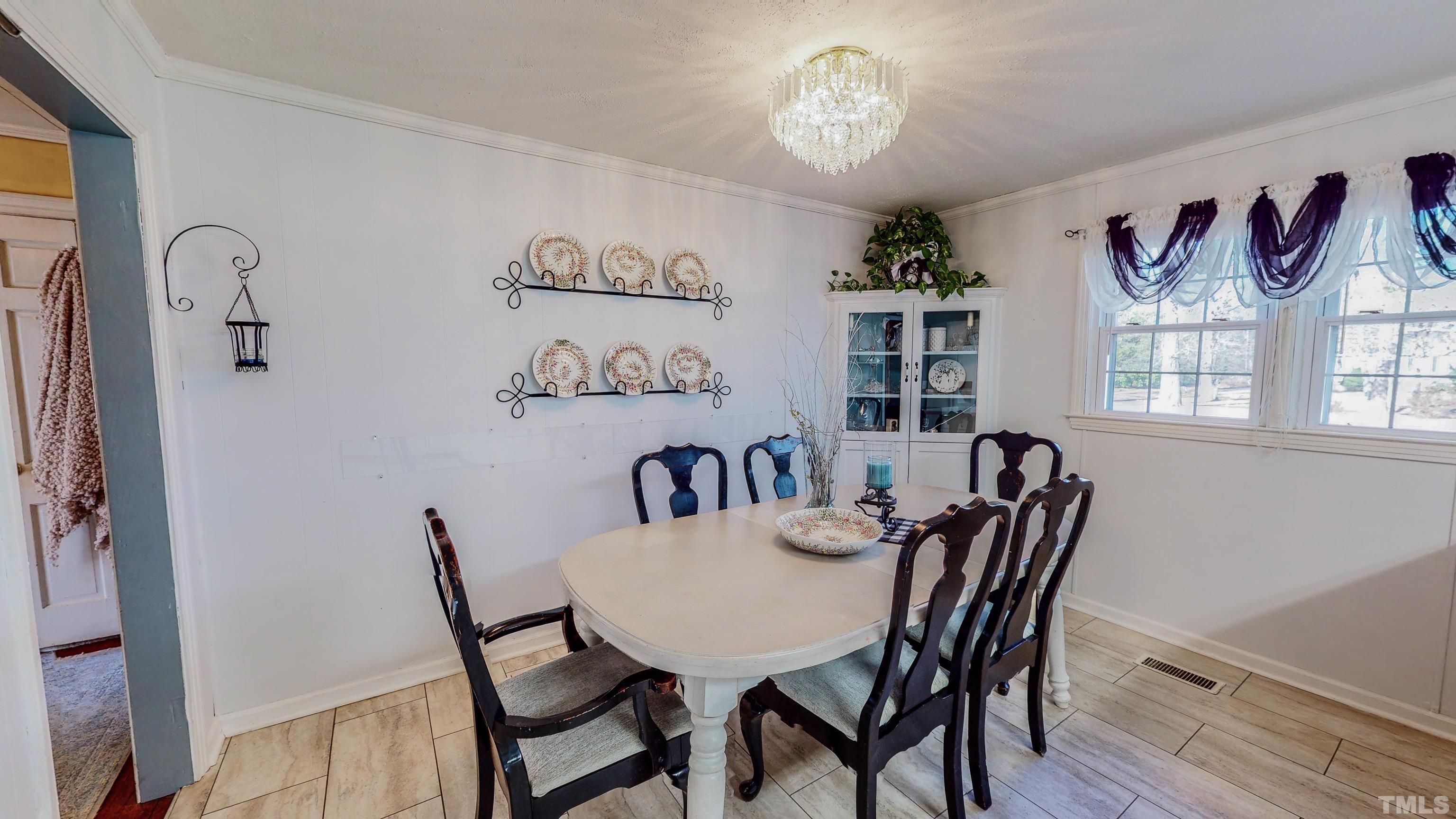 155 Hesters Store Road Roxboro, NC 27574 - Photo 42 of 77 a view of a dining room with furniture window and wooden floor