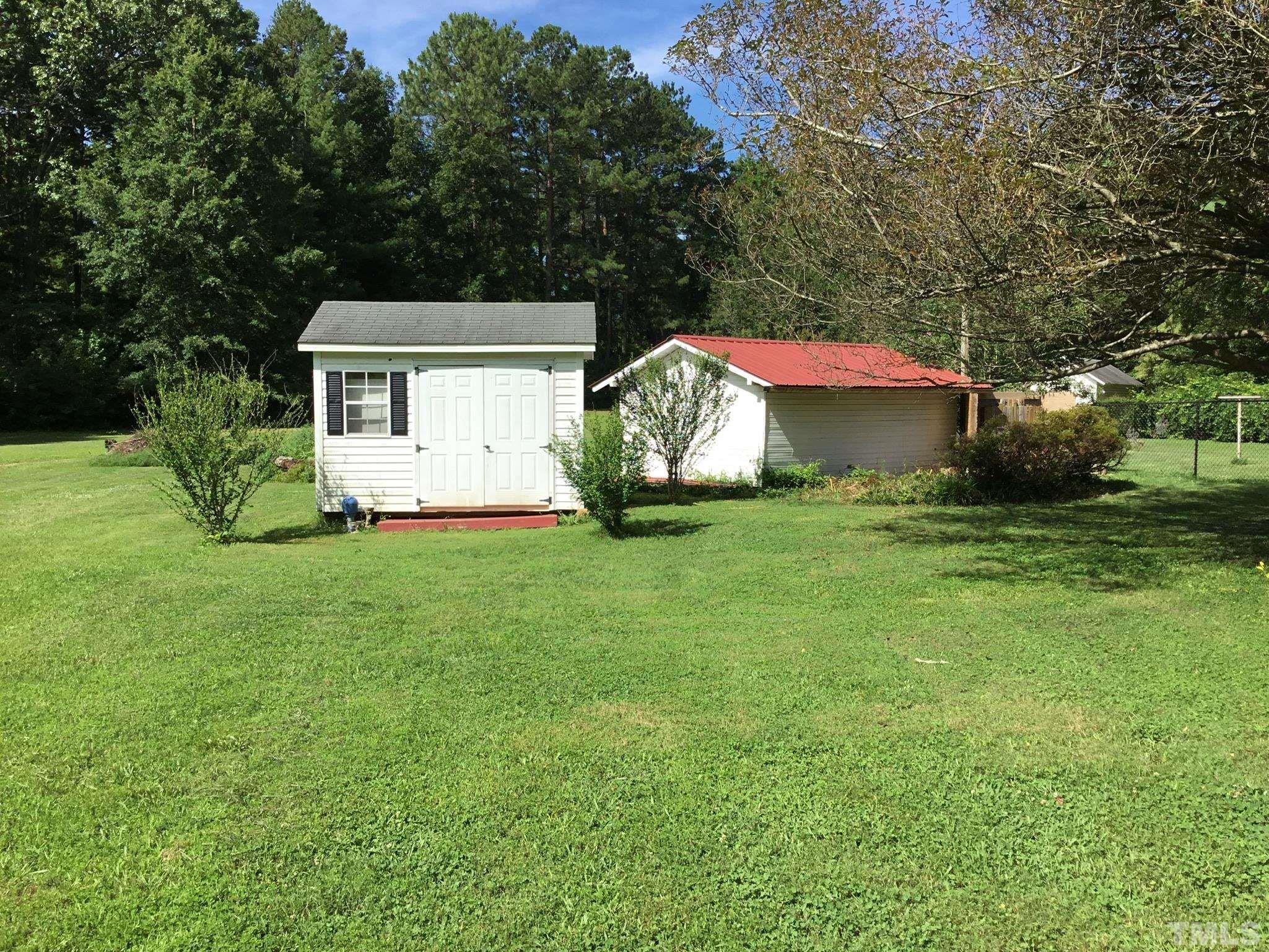 155 Hesters Store Road Roxboro, NC 27574 - Photo 52 of 77 a view of a house with a yard