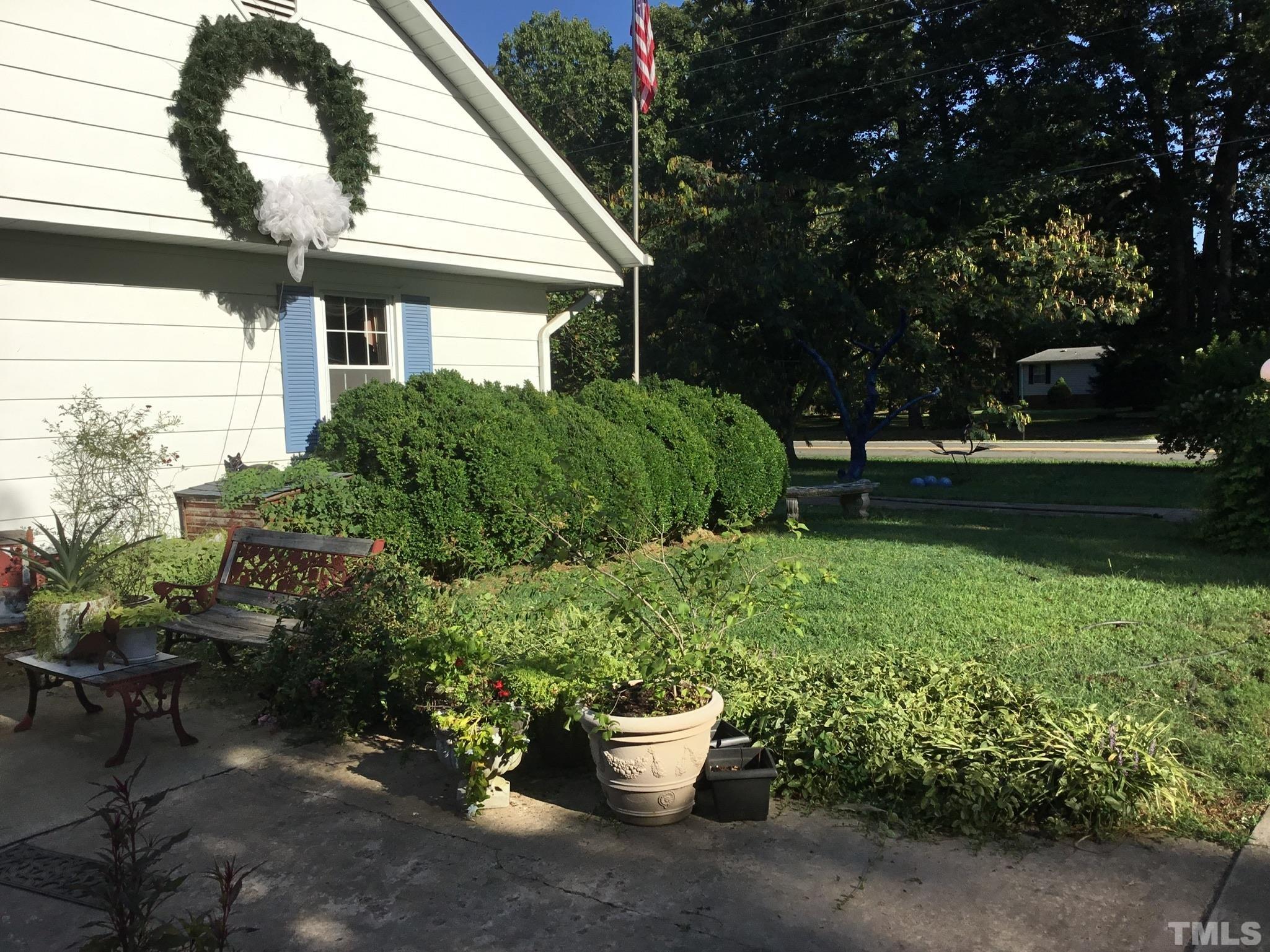 155 Hesters Store Road Roxboro, NC 27574 - Photo 60 of 77 a view of a backyard with garden and plants