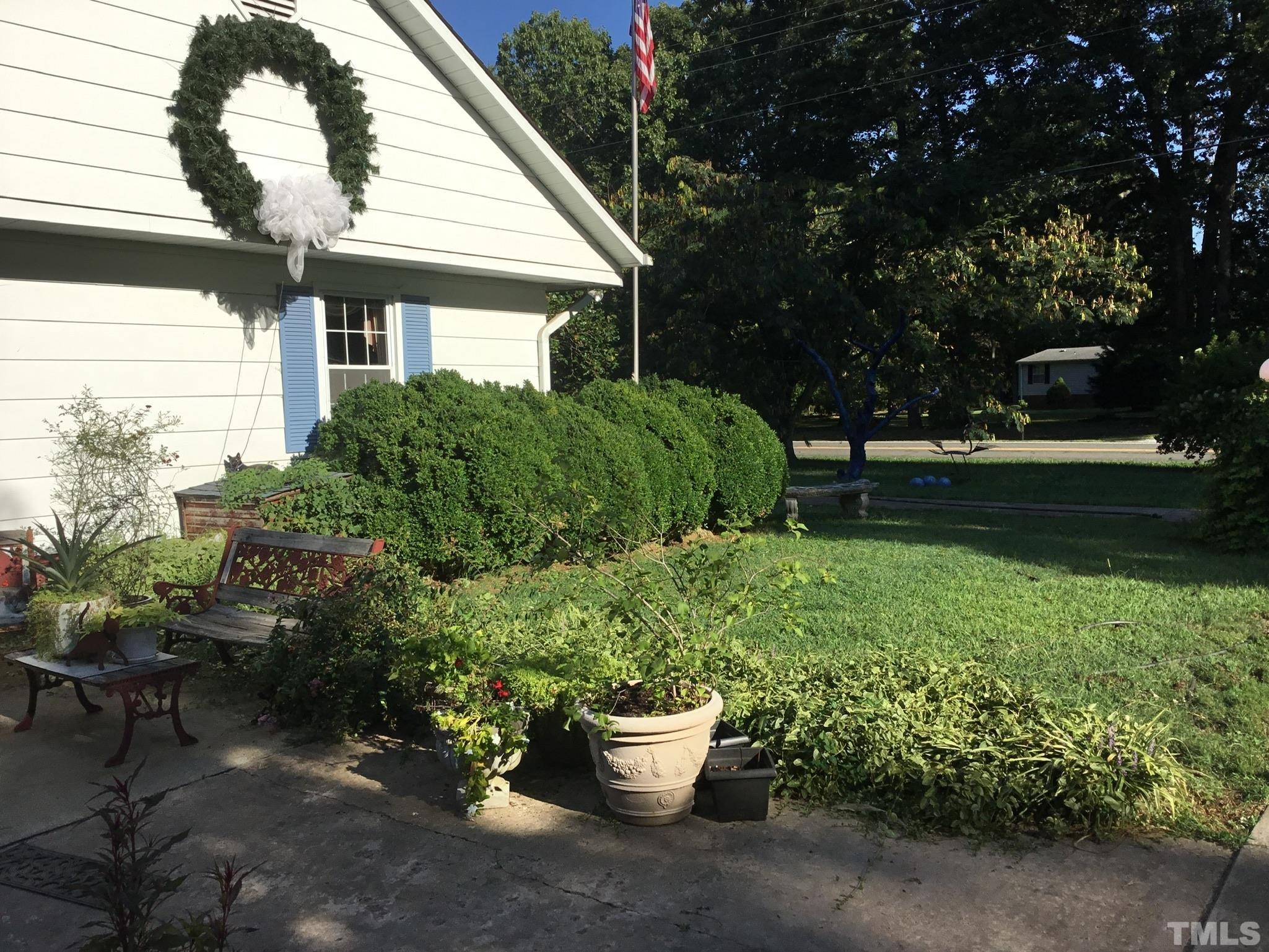155 Hesters Store Road Roxboro, NC 27574 - Photo 71 of 77 a view of a backyard with garden and plants