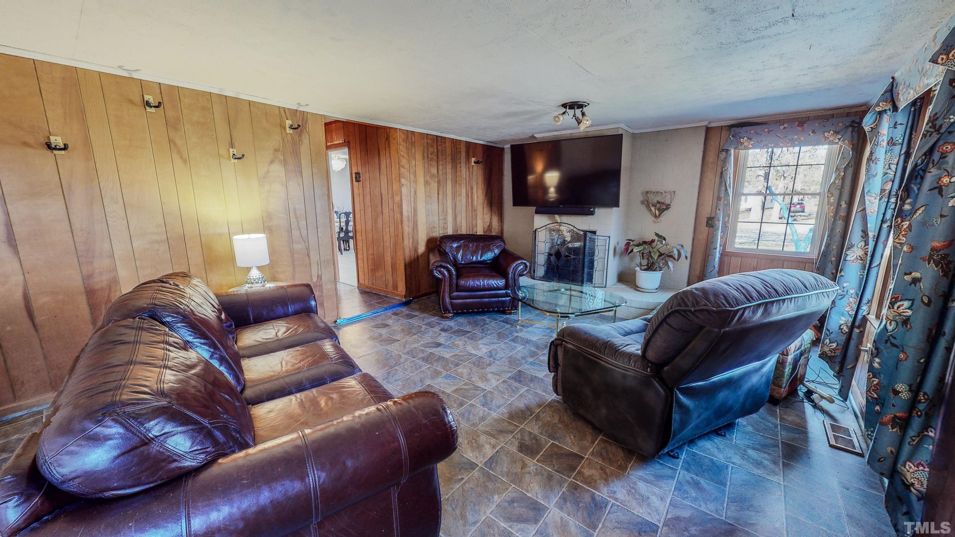 155 Hesters Store Road Roxboro, NC 27574 - Photo 10 of 77 a living room with furniture or couch and a flat screen tv