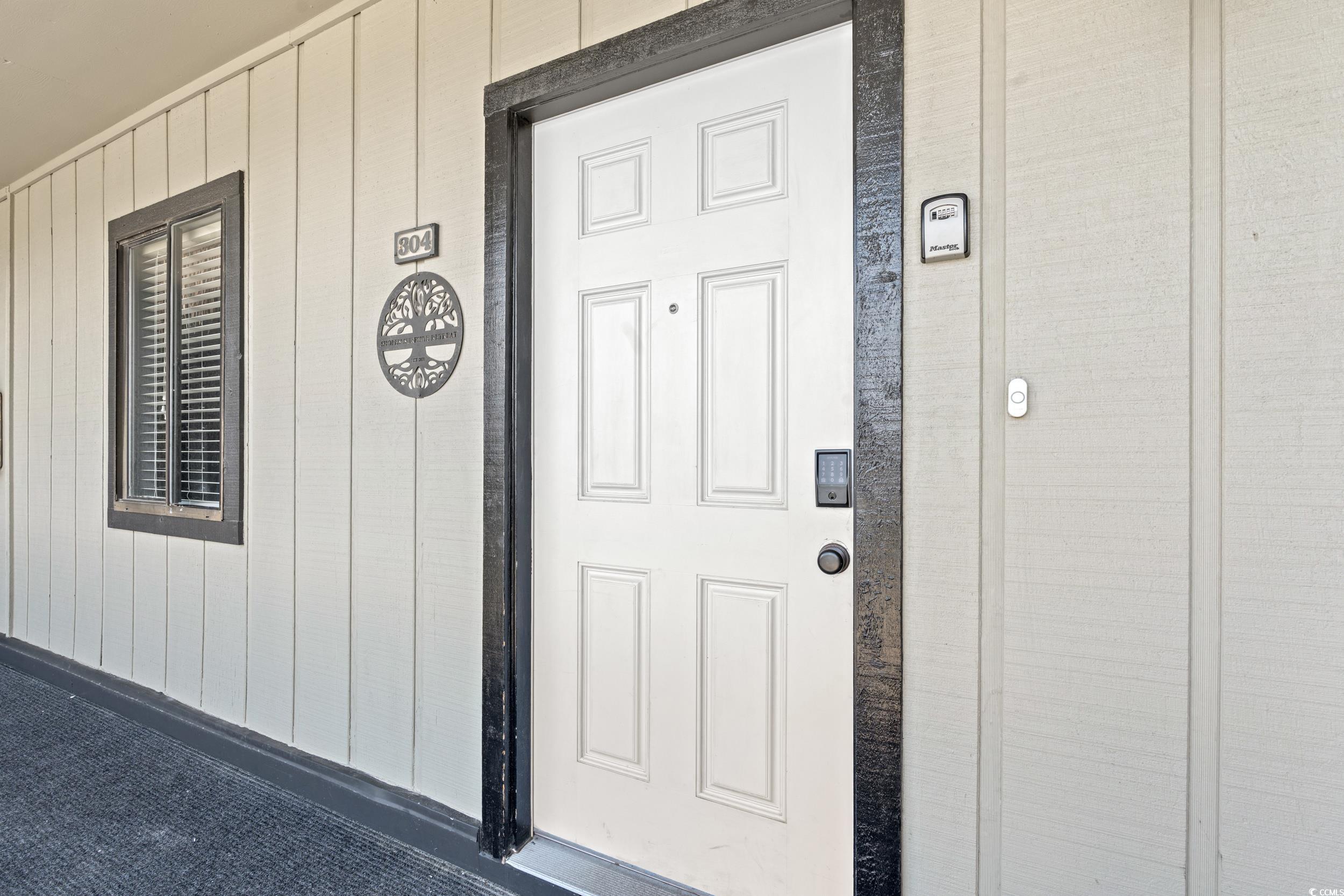 917 Ocean Boulevard South, Unit 304 Surfside Beach, SC 29575 - Photo 2 of 38 View of exterior entry
