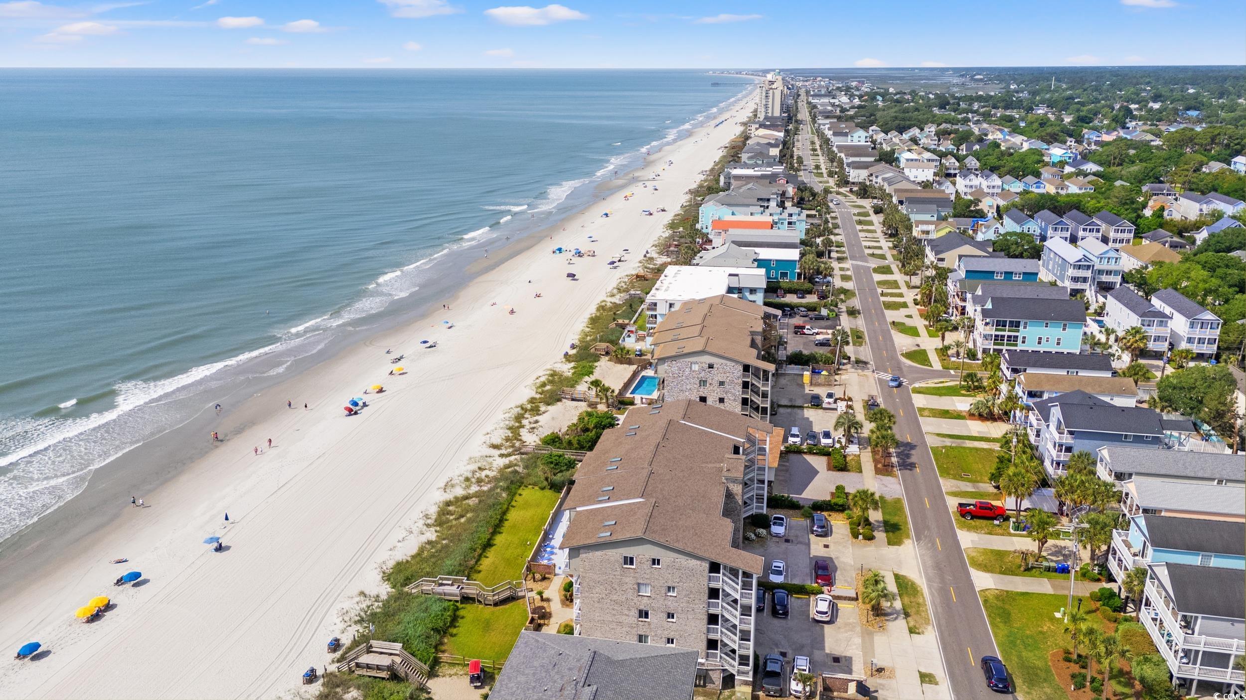917 Ocean Boulevard South, Unit 304 Surfside Beach, SC 29575 - Photo 29 of 38 Aerial perspective of suburban area with extended coastline