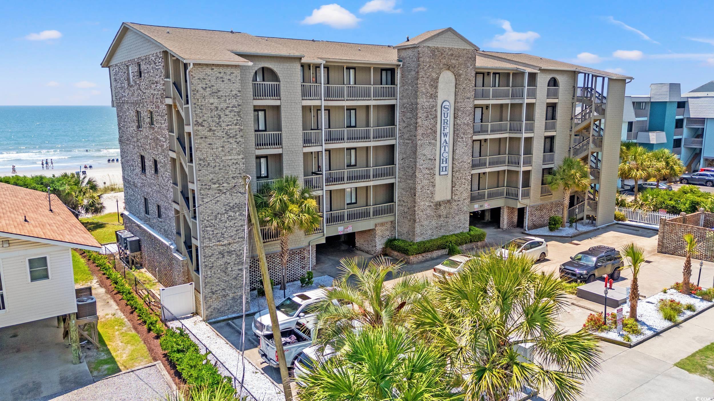 917 Ocean Boulevard South, Unit 304 Surfside Beach, SC 29575 - Photo 31 of 38 View of apartment building / complex featuring a water view