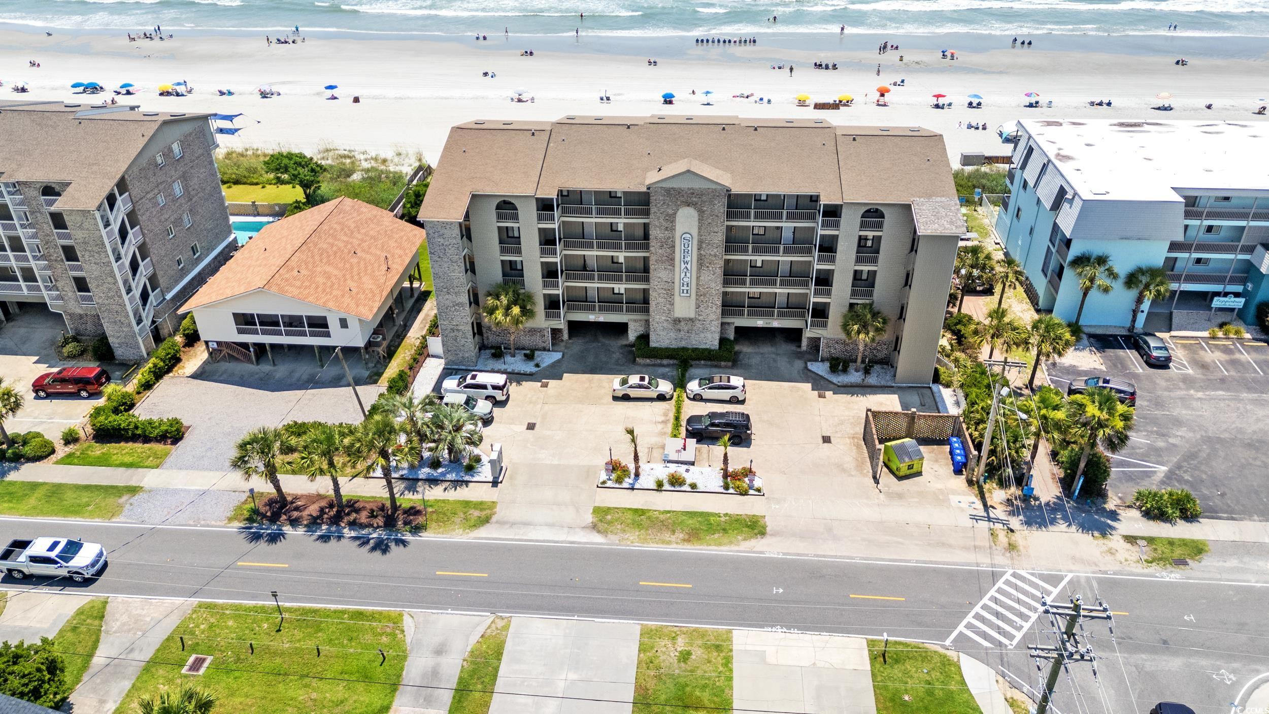 917 Ocean Boulevard South, Unit 304 Surfside Beach, SC 29575 - Photo 32 of 38 Drone / aerial view of apartment complex / building and unending shoreline