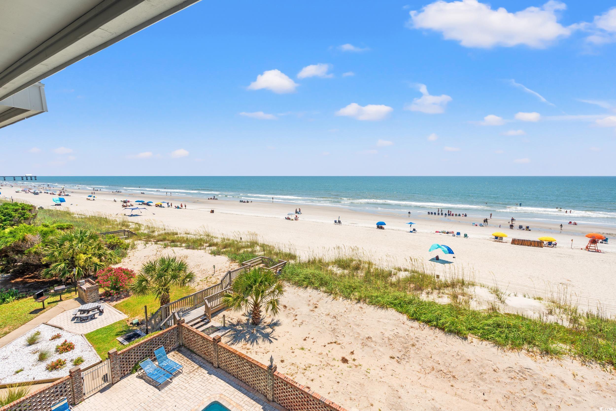 917 Ocean Boulevard South, Unit 304 Surfside Beach, SC 29575 - Photo 8 of 38 Water view featuring a fire pit and nearby beach