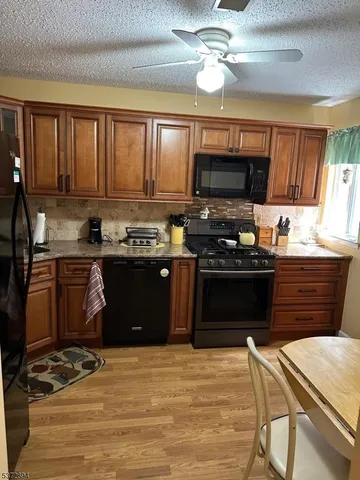 a kitchen with a stove and a microwave
