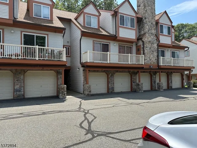 a front view of a house with parking
