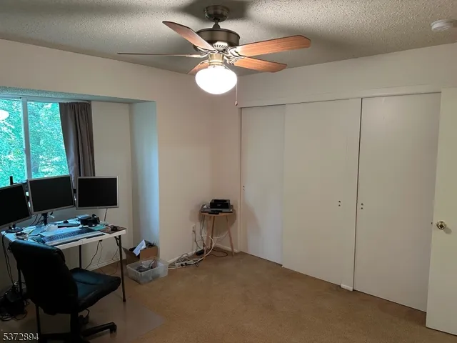 a workspace with furniture and window