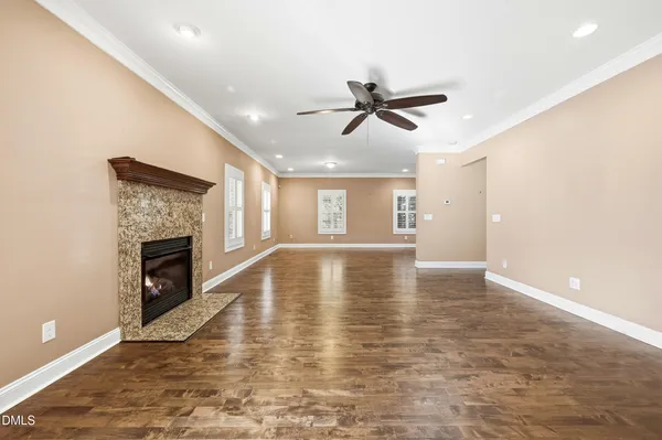 a view of livingroom with hardwood floor and a ceiling fan