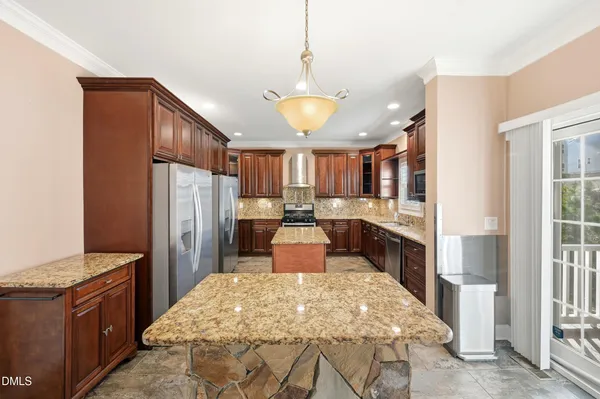 a kitchen with a refrigerator sink and stove