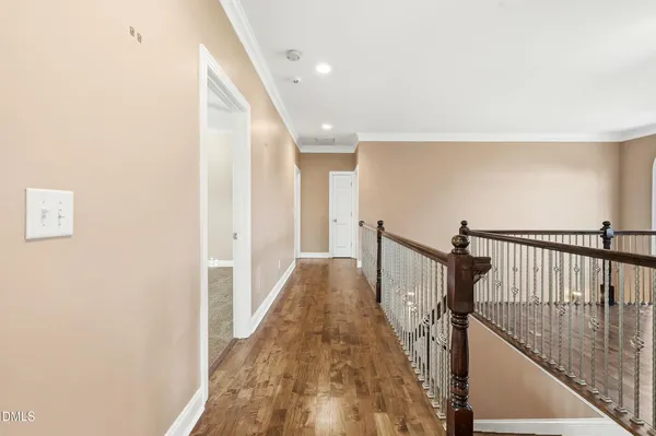 a view of gallery with wooden floor