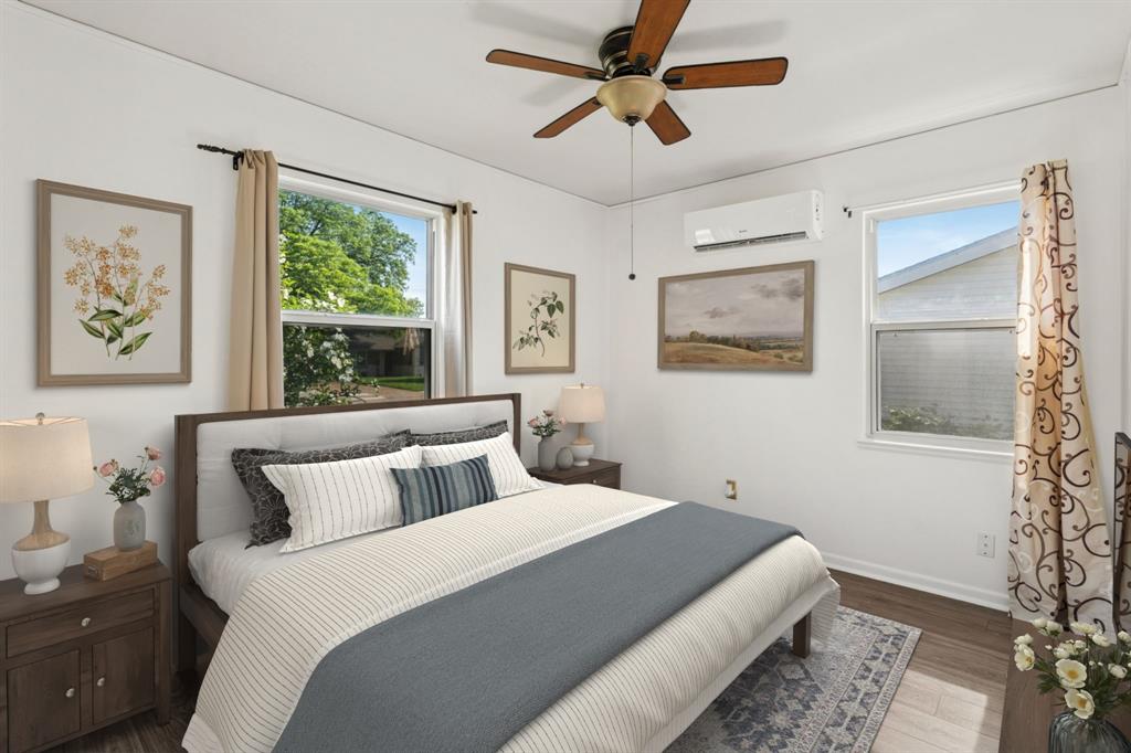 1822 Finley Road Irving, TX 75062 - Photo 22 of 38 a bedroom with a large bed and a window