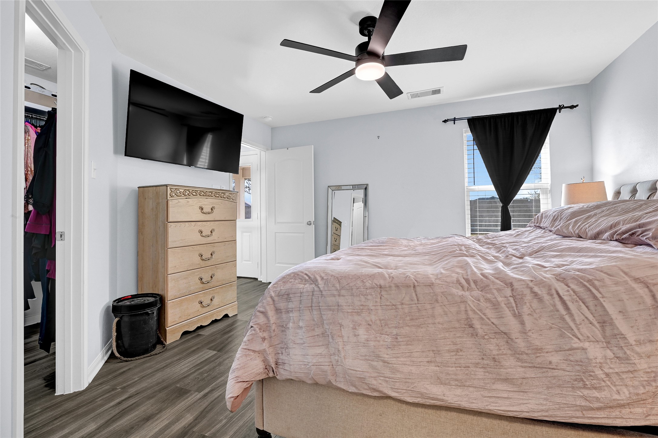 1802 Opal Peach Drive Rosharon, TX 77583 - Photo 17 of 35 a bedroom with a bed a window and a flat screen tv