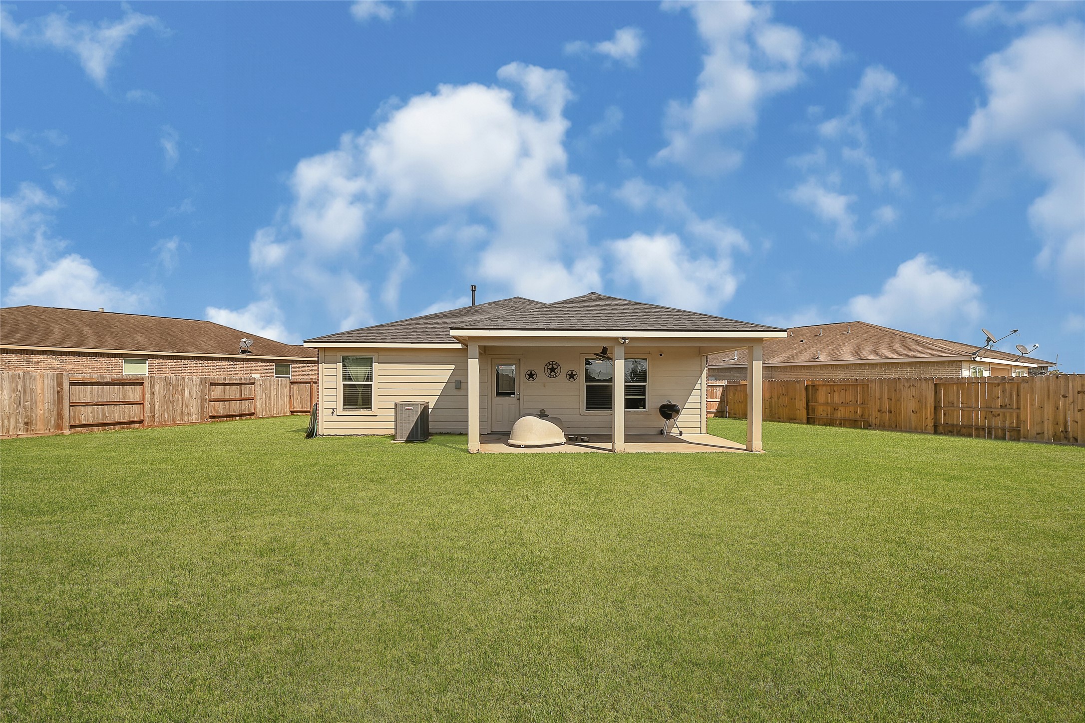 1802 Opal Peach Drive Rosharon, TX 77583 - Photo 20 of 35 a view of a house with a big yard and large trees