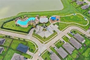 1802 Opal Peach Drive Rosharon, TX 77583 - Photo 29 of 35 an aerial view of a swimming pool with a garden