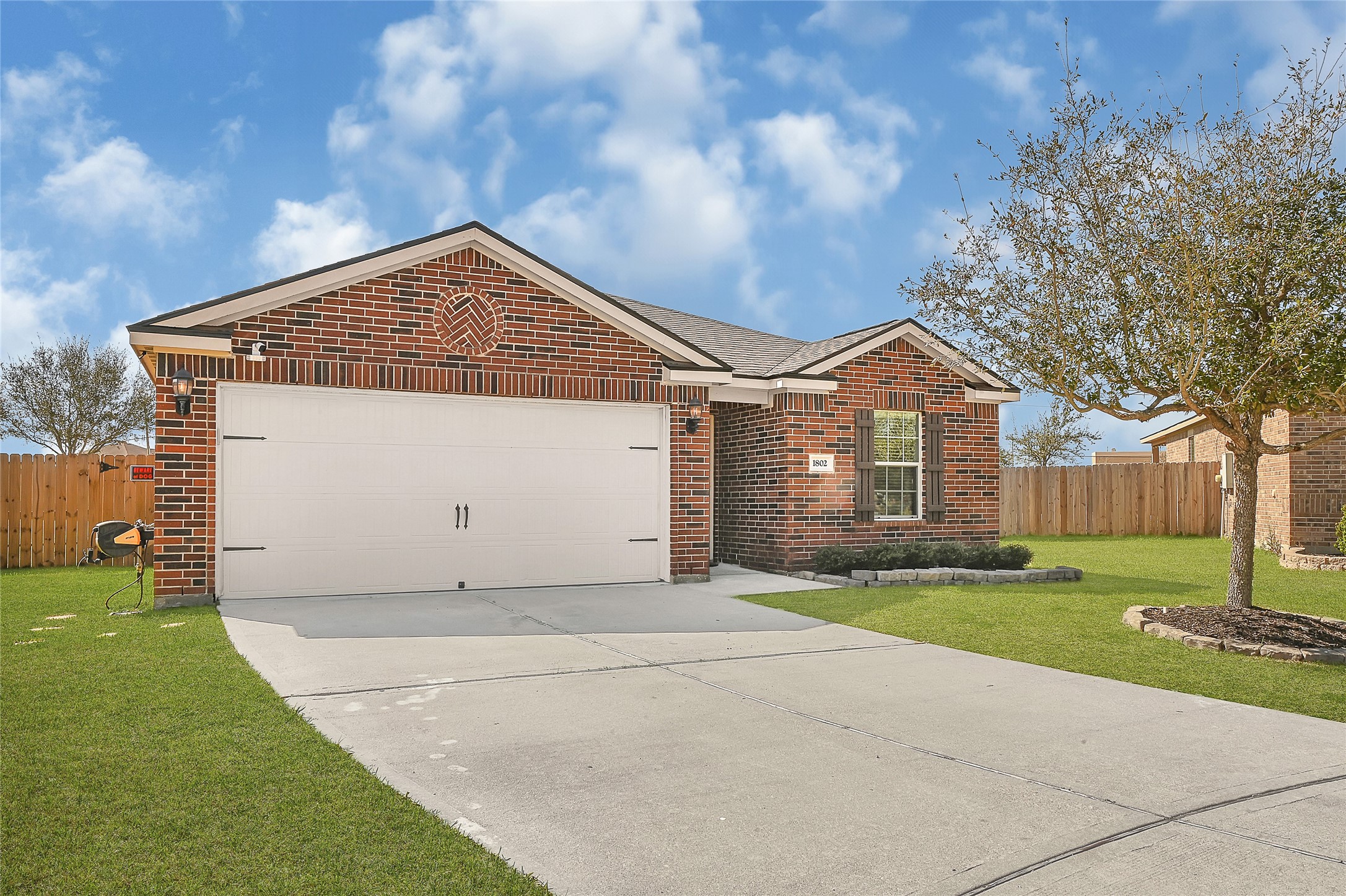 1802 Opal Peach Drive Rosharon, TX 77583 - Photo 30 of 35 a front view of house with yard and green space